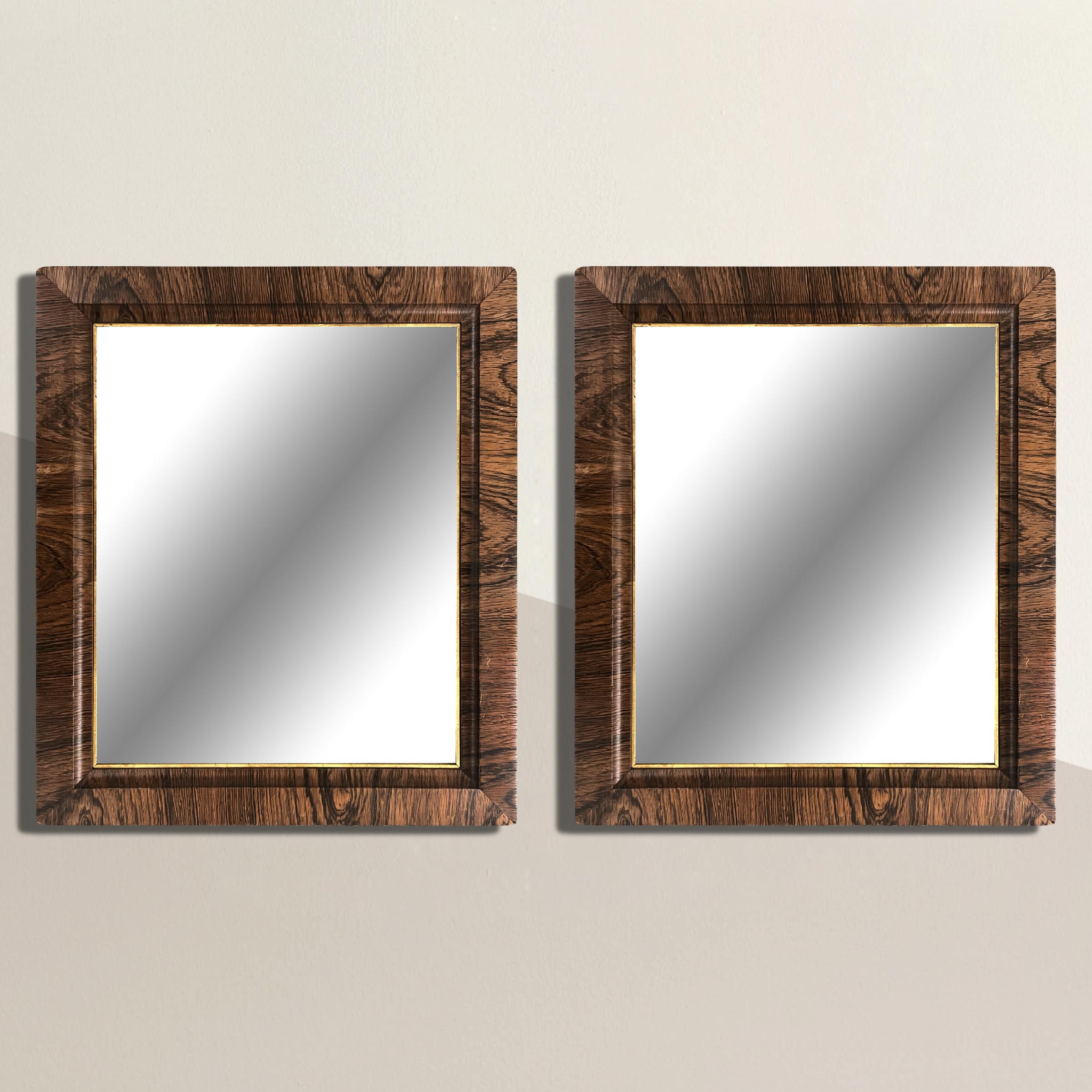 A bold pair of 19th century American framed mirrors with the most wonderful weathered oak veneer frames, and gold leaf fillets. Perfect above a pair of console tables, nightstands, or flanking any doorway in your home.