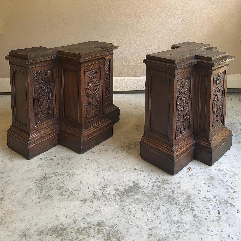 Pair of 19th century French architectural hand carved column pediments are very rare to find as pair. Carefully salvaged from a French church, each served as column pediments which once flanked a main passageway and supported columns flanking a