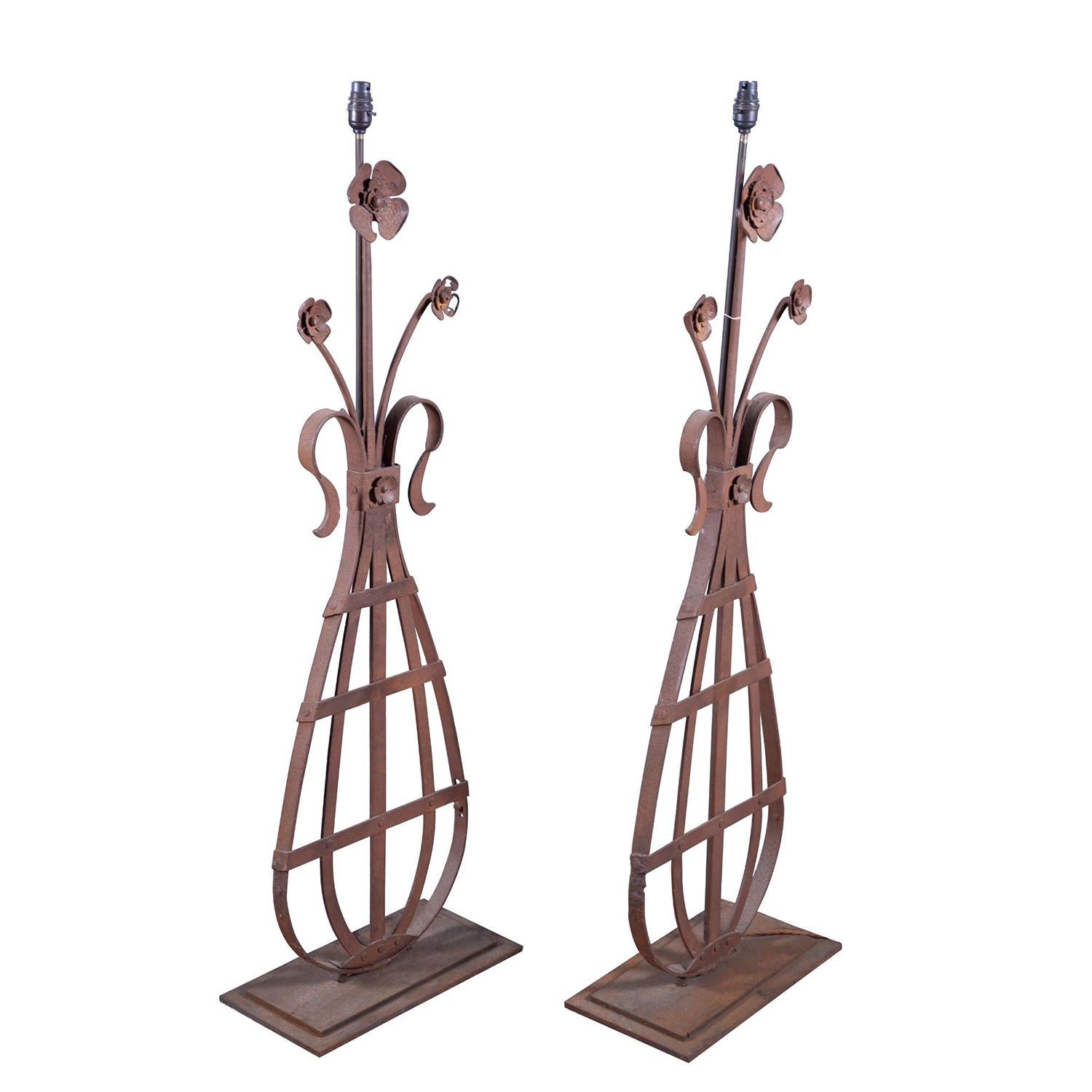 This pair of 19th century lamps are made from architectural fragments of a French 19th century metal gate post in the shape of a vase with flowers. This piece has been rewired with silk cord to UK PAT tested standards.