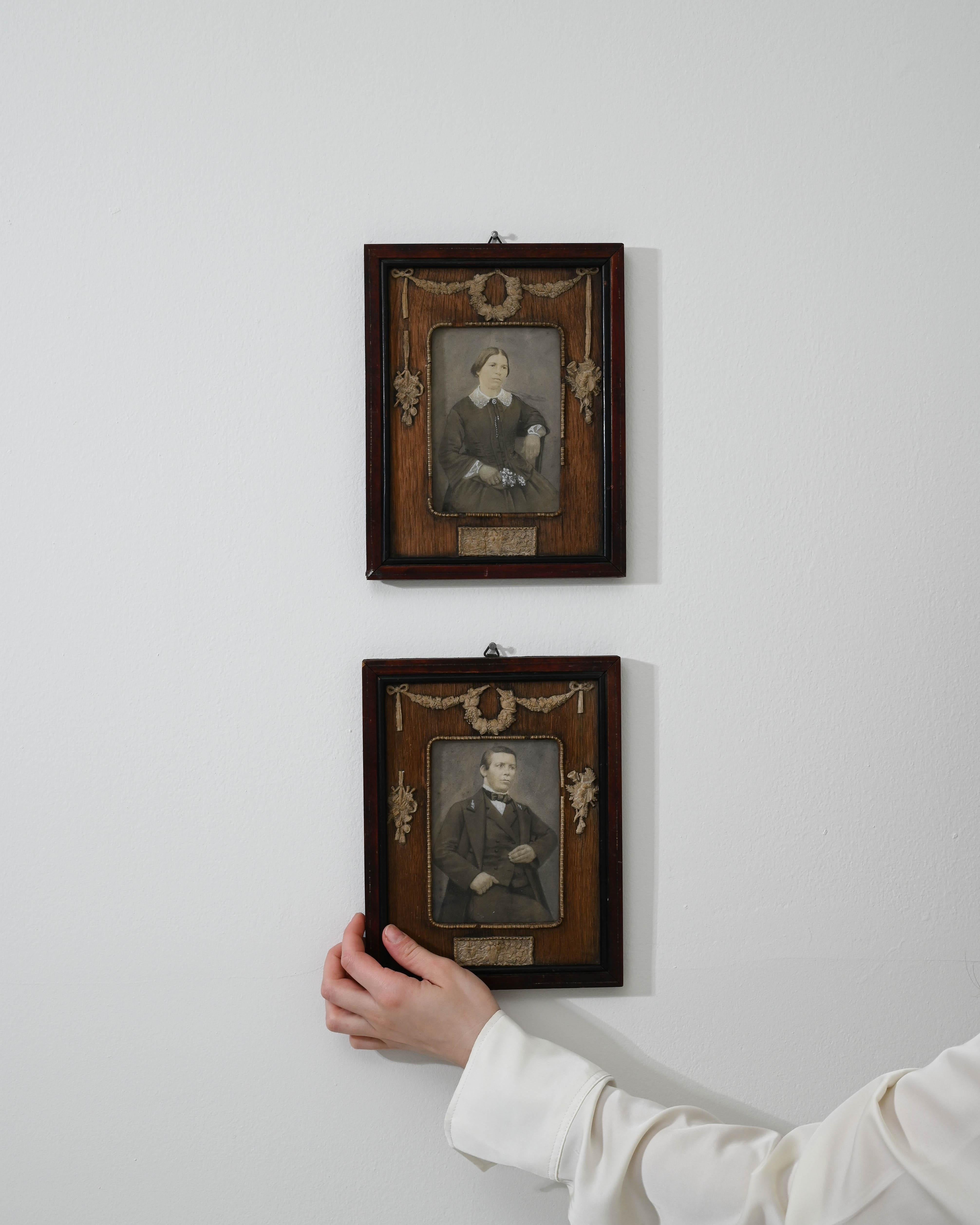 Enrich your space with the timeless allure of this Pair of 19th Century French Artworks adorned with exquisite wooden frames. Each frame tells a story, one featuring a captivating portrayal of a woman and the other of a distinguished man from the