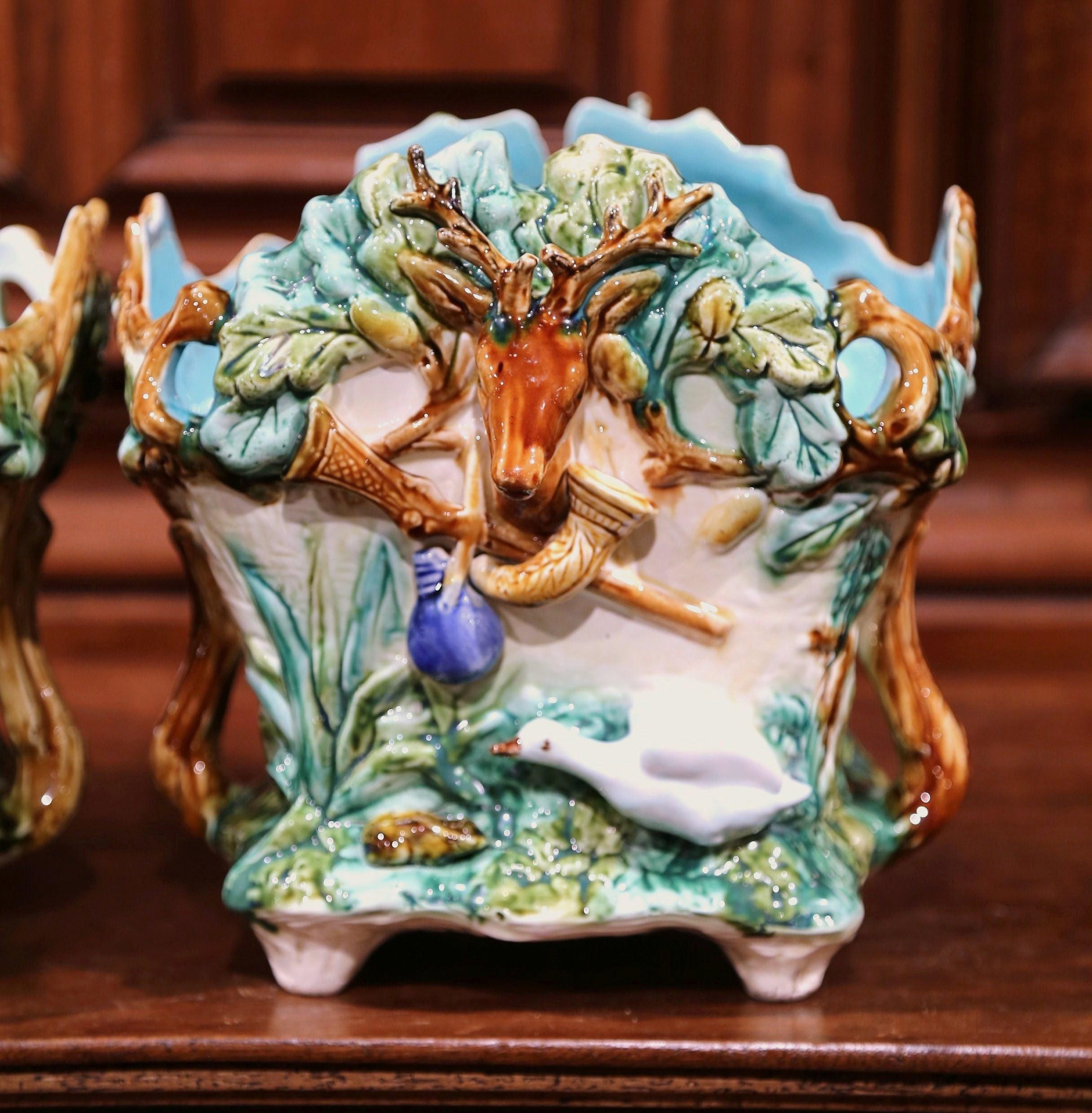 Hand-Carved Pair of 19th Century French Barbotine Painted Cachepots with Hunt Trophy Motifs