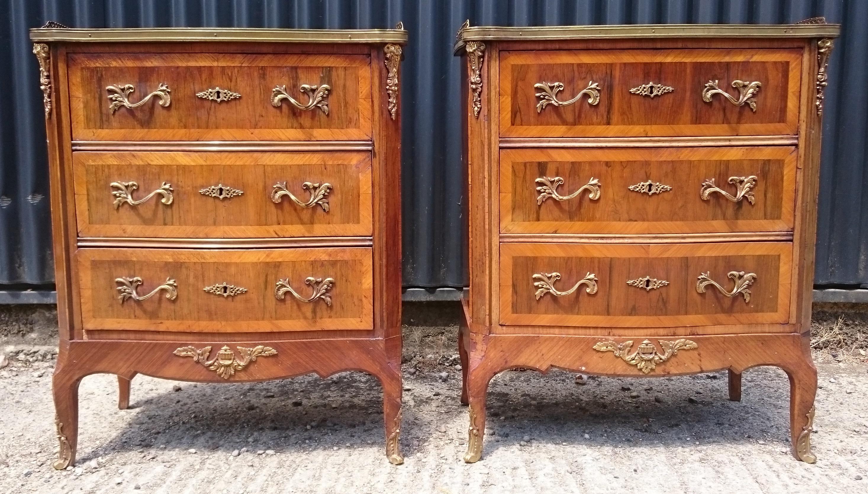19th century French pair of antique bedside cupboards, this charming and useful pair of bedside cupboards have lovely inlay, crossbanding and quarter cut tops, there are some generously shaped ormolu mounds, escutcheons and handles and they have