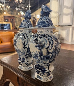 Pair of 19th Century French Blue and White Faience Delft Vases with Parrot Lids