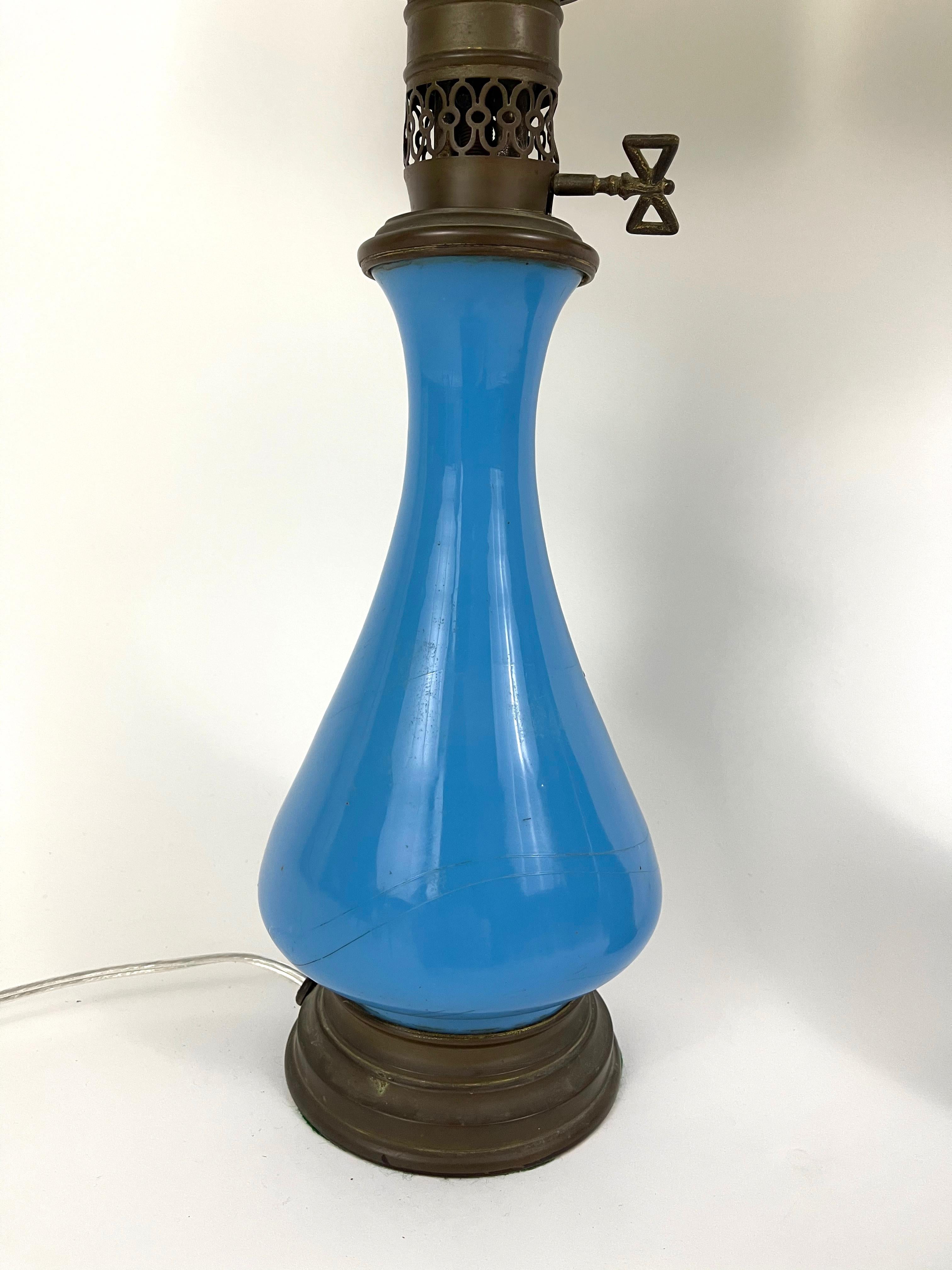 A pair of 19th century French blue opaline glass oil lamps, electrified and newly re-wired, with new shades. Wonderful, vibrant color.

Measures: Height 25 1/2