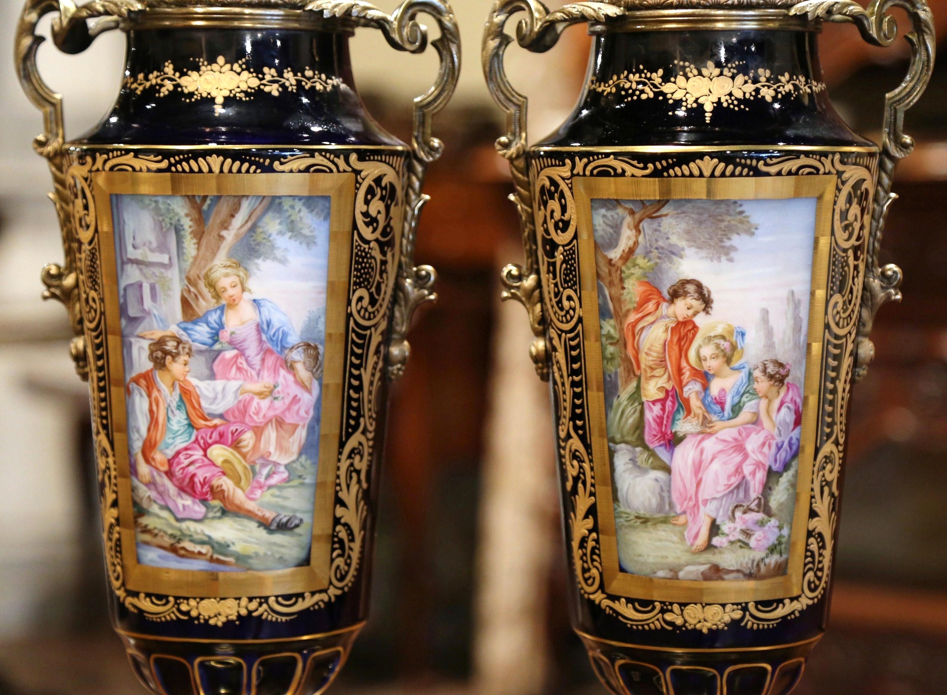Hand-Painted Pair of 19th Century French Blue Royal Porcelain and Bronze Sevres Urns