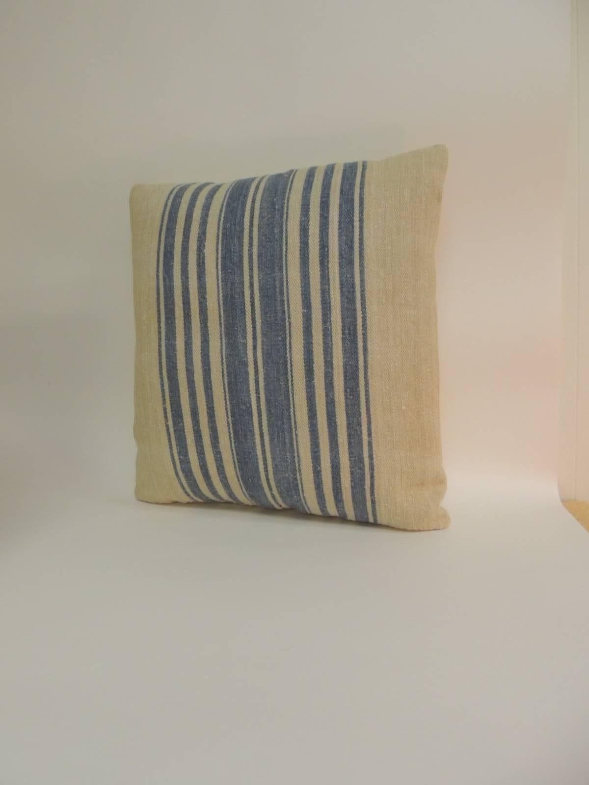 The antique textile in the front of these decorative pillows show vertical stripes 
with a chevron woven homespun textile. French decorative cushions 
finished with natural linen backings. In shades of blue, tan and natural. 
Throw pillows are