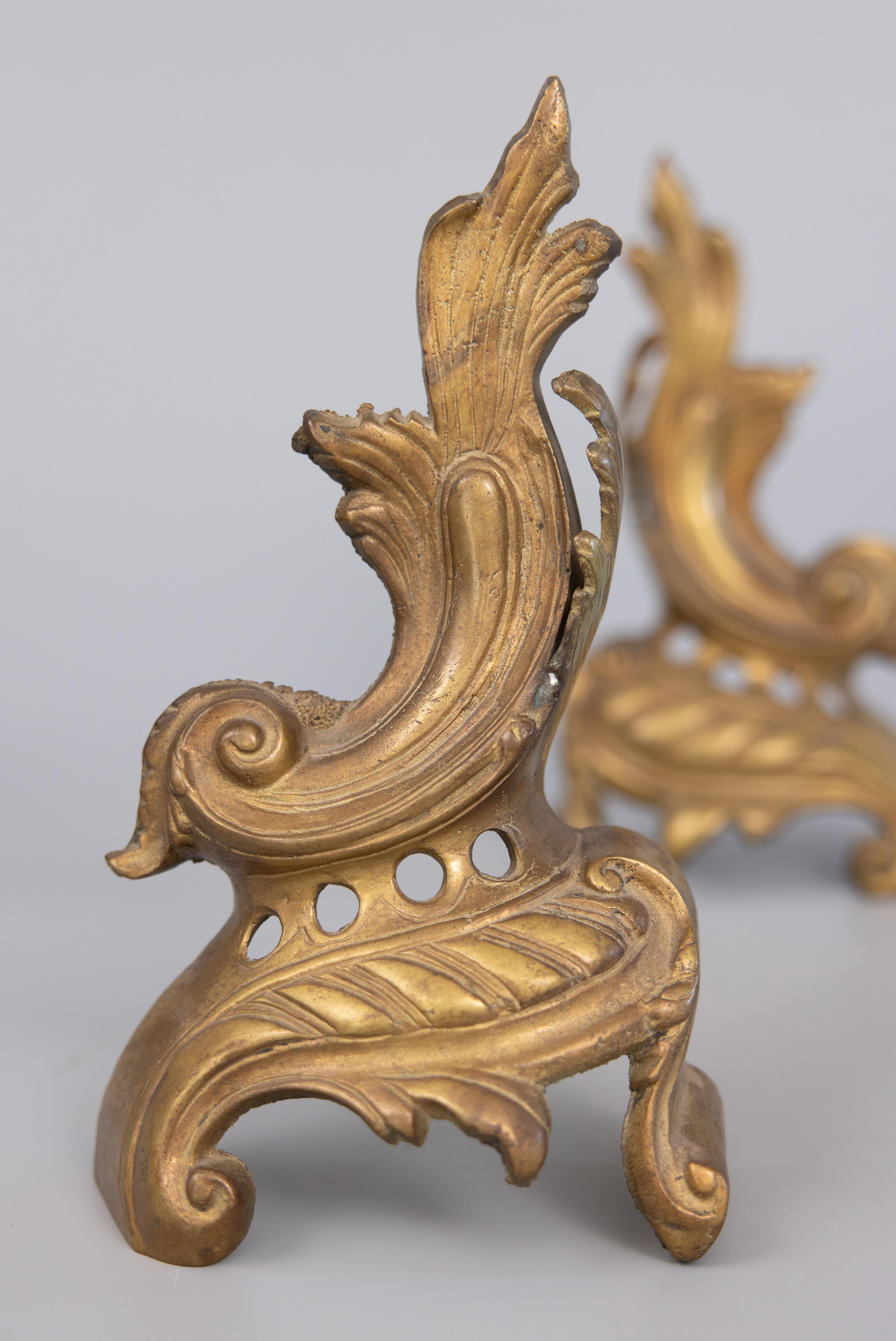 A gorgeous pair of 19th century French ornate brass mantel ornaments or bookends with stylized acanthus leaves. They would be lovely displayed on a mantel, bookshelf, or desk.