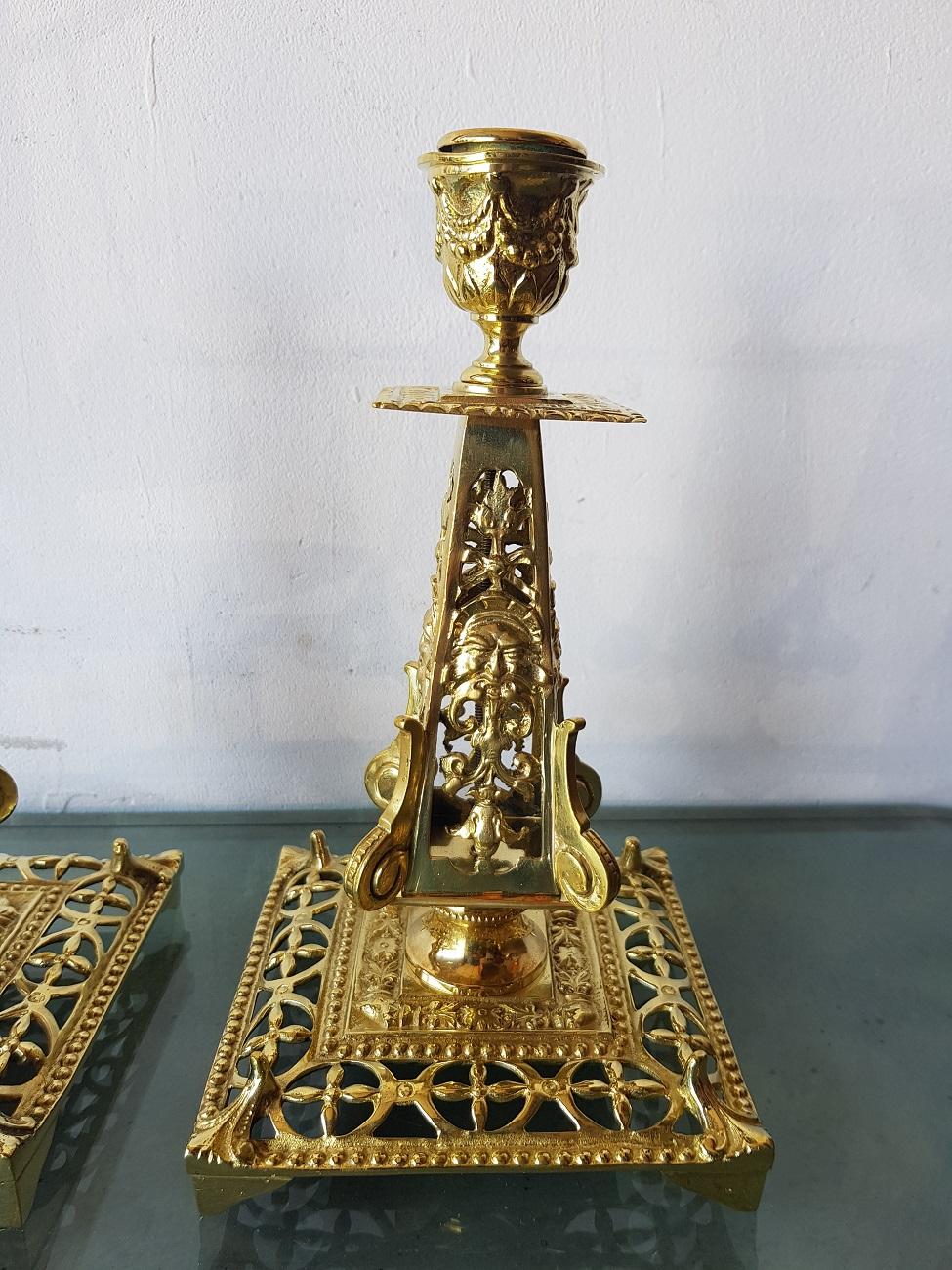 A pair of two beautiful French openworked brass candlesticks with grotesque heads all around, the are made in the 19th century.

The measurements are,
Depth 13 cm/ 5.1 inch.
Width 13 cm/ 5.1 inch.
Height 22.5 cm/ 8.8 inch.
 