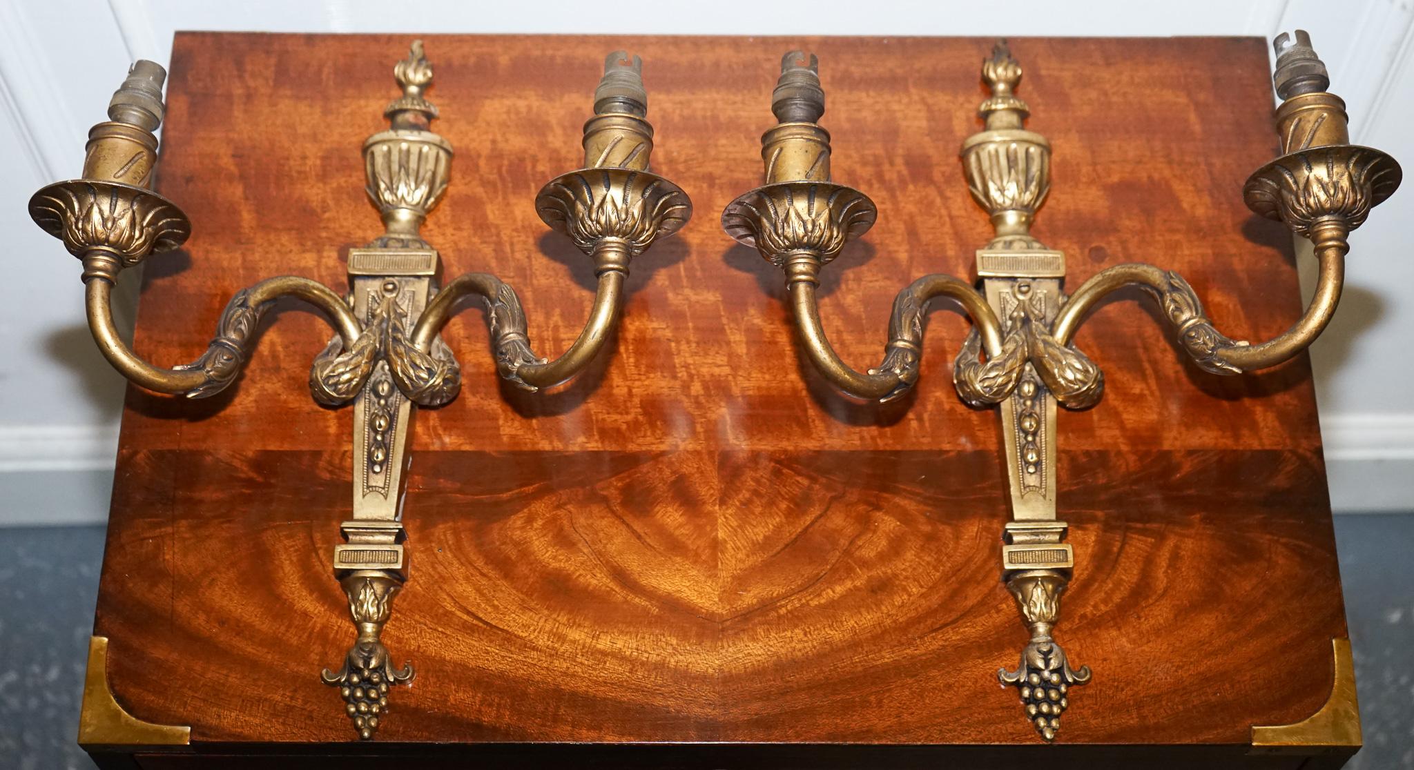 Antiques of London

We are delighted to offer for sale this Pair Of 19th-century French Brass Sconces.

 Exudes timeless elegance and classical charm. Each sconce features two gracefully curved branches, designed to hold candles or, in later