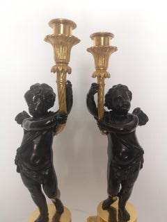 Pair of 19th Century French Bronze and Gilt Cherub Candlesticks
