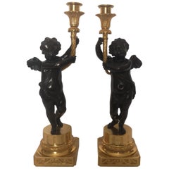 Pair of 19th Century French Bronze and Gilt Cherub Candlesticks