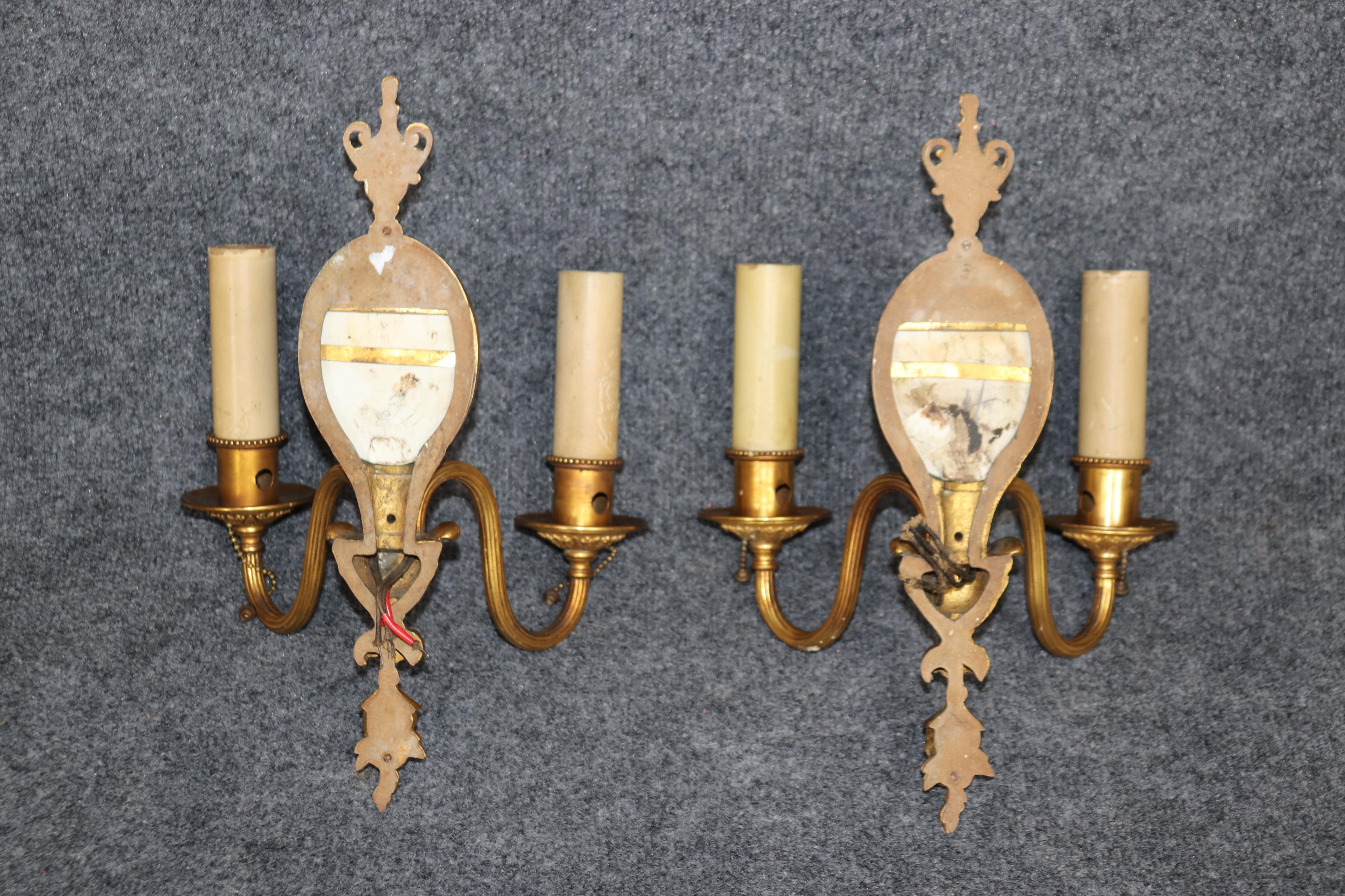 Dimensions- H: 14in W: 9 3/4in D: 5in

This pair of Louis XV style bronze ormolu sconces with wedgewood plaques is made of the highest quality and are a fine example of 19th century  decor. If you look at the photos provided, you will see the