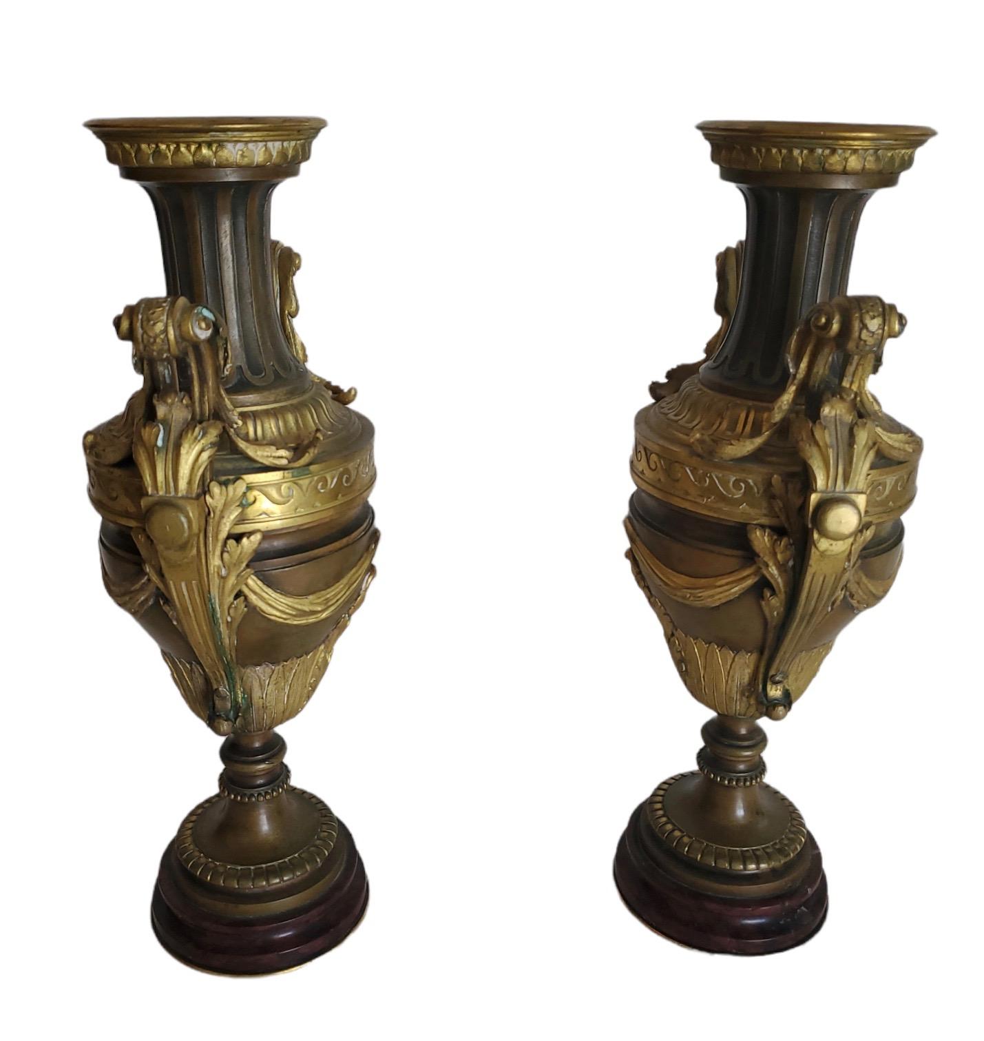 Pair of handled finely chased and cast bronze and dore bronze urns/garniture.