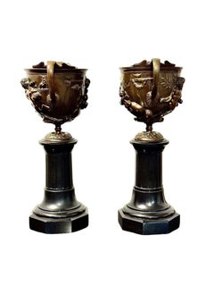 Pair of 19th Century French Bronze Urns on Black Marble Pedestals