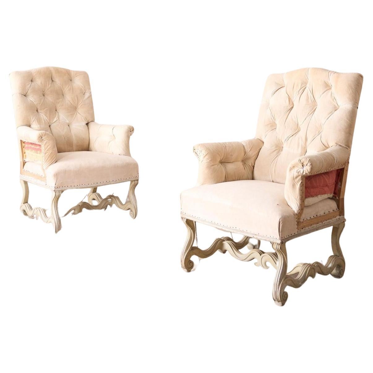 Pair of 19th century French buttoned back armchairs with painted carved frame For Sale