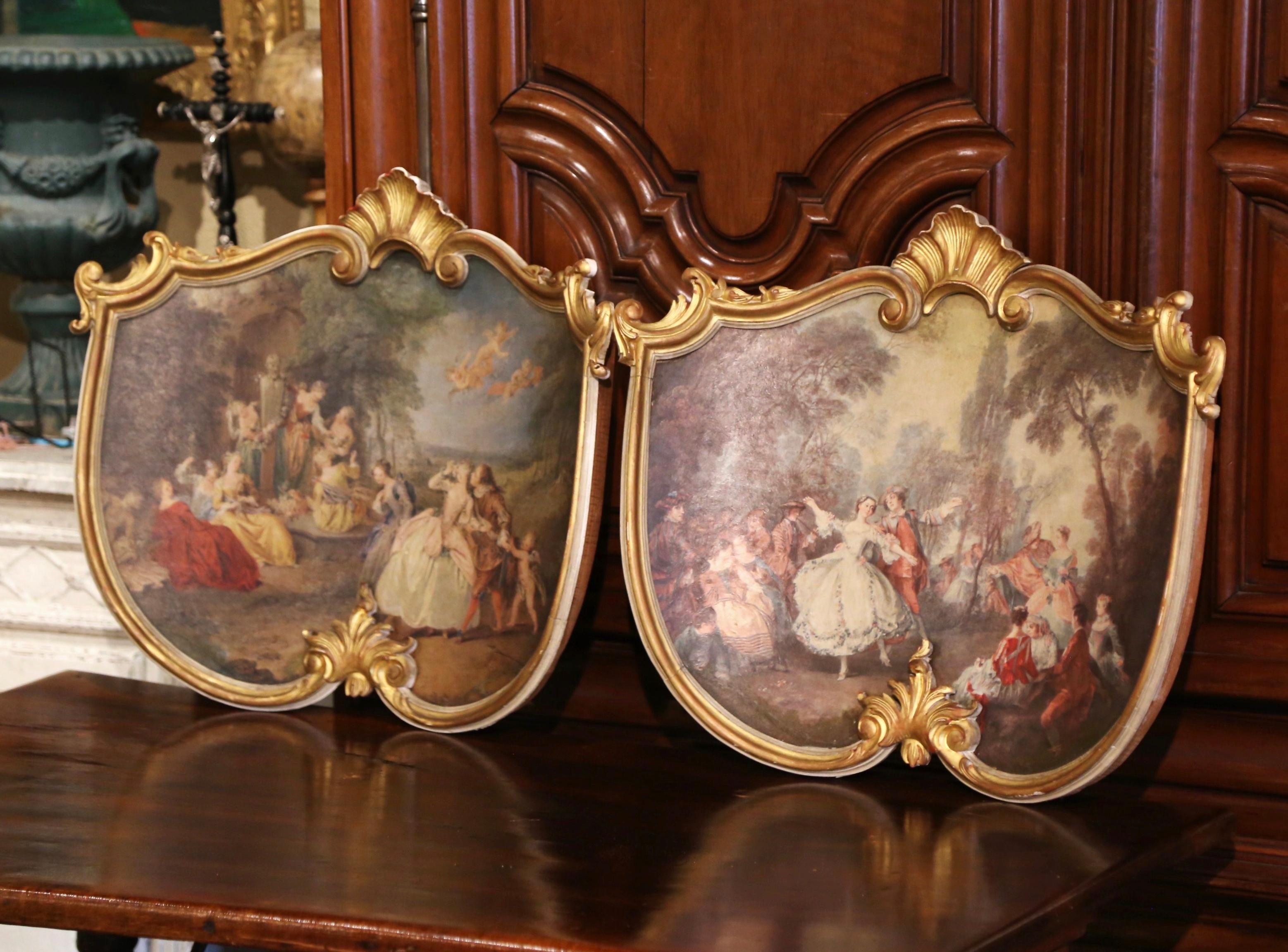 Decorate a study or office with this elegant pair of colorful antique wall plaques. Crafted in France circa 1890, the curved wall decors shaped as shields, are set in a gilt frame decorated with shell motifs at the pediment and the bottom; each hand
