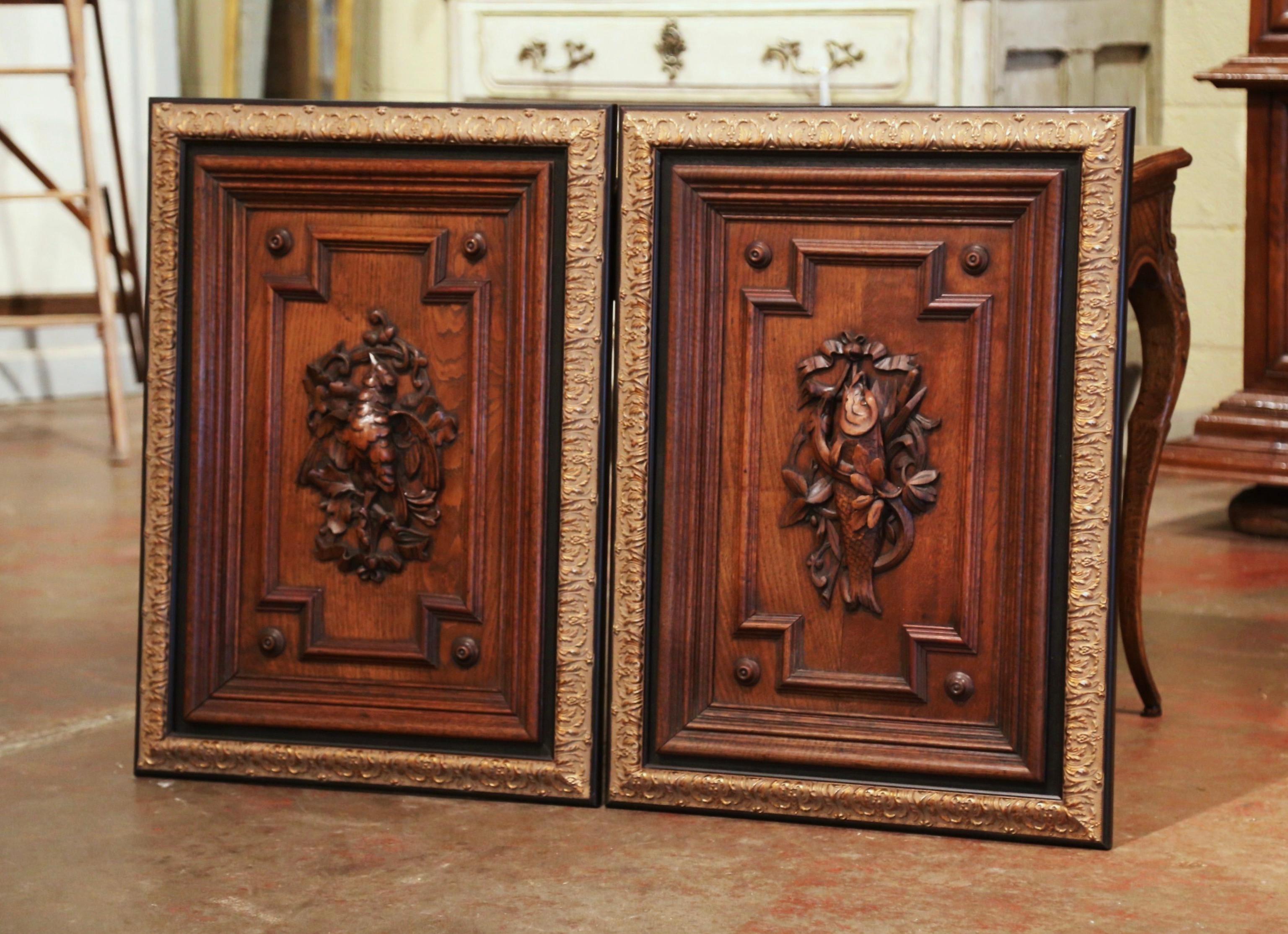 Decorate a man's office with this pair of elegant antique panels. Crafted in France circa 1870, and made of oak, the sculpted elements are decorated with exquisite carvings in high relief; one-door features a central medallion with a bird, foliage