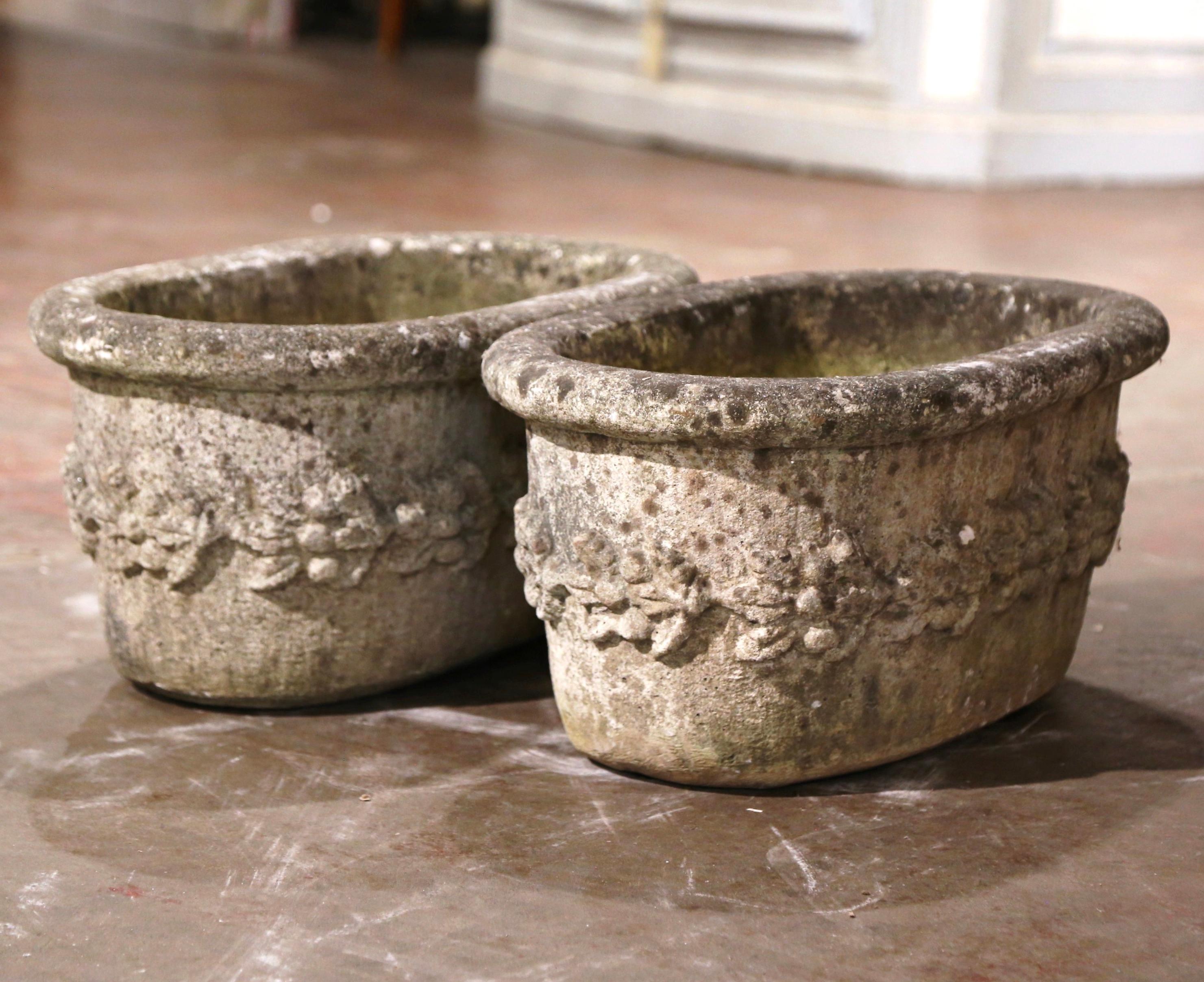 Patinated Pair of 19th Century French Carved Stone Planters with Floral Decor