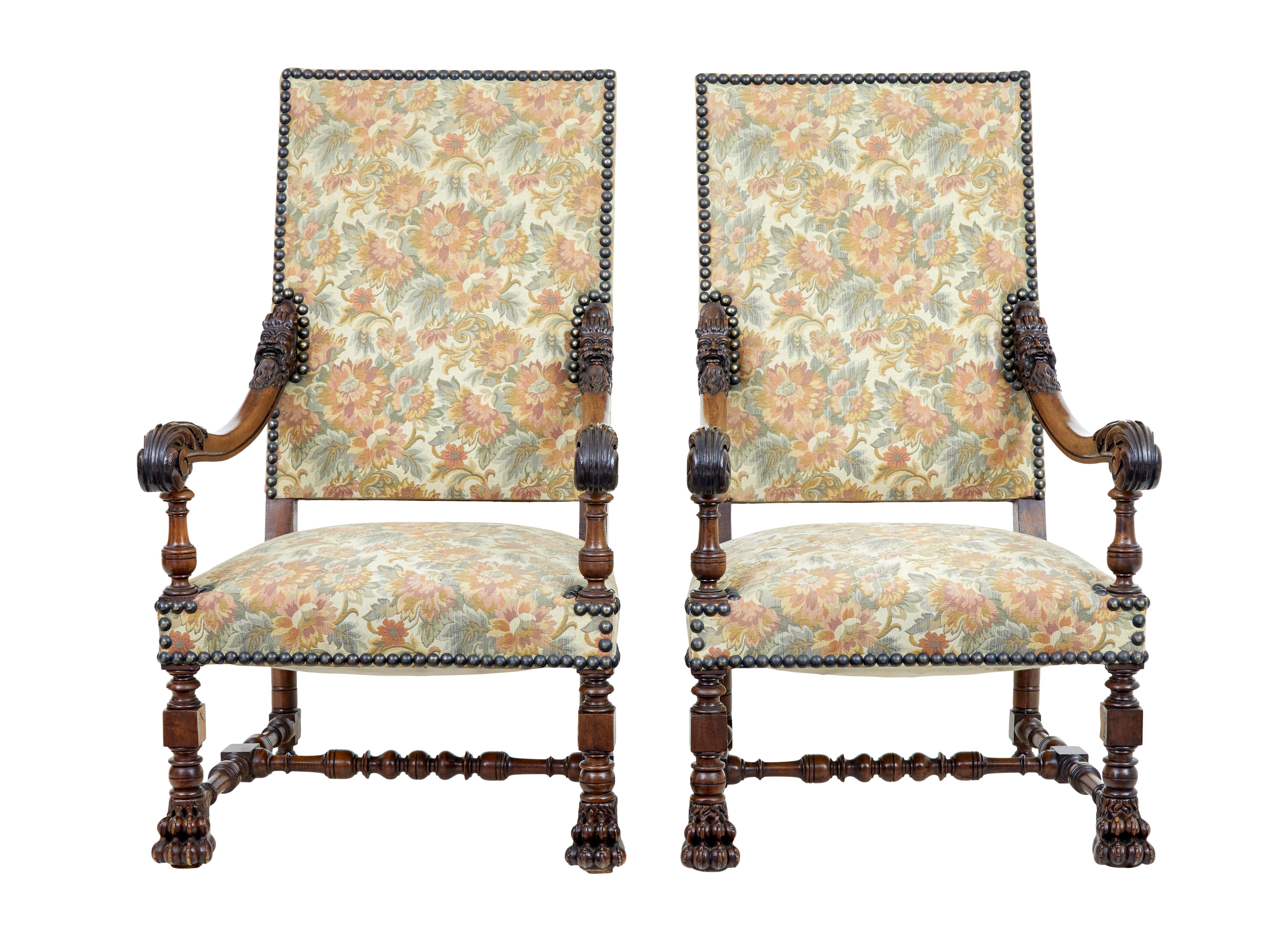 Fine pair of 19th century french carved walnut armchairs circa 1870.

Beautifully carved pair of french armchairs of good large proportions. Carved mythical heads to the top of each arm, scrolling arms. Standing on lion paw front feet united by