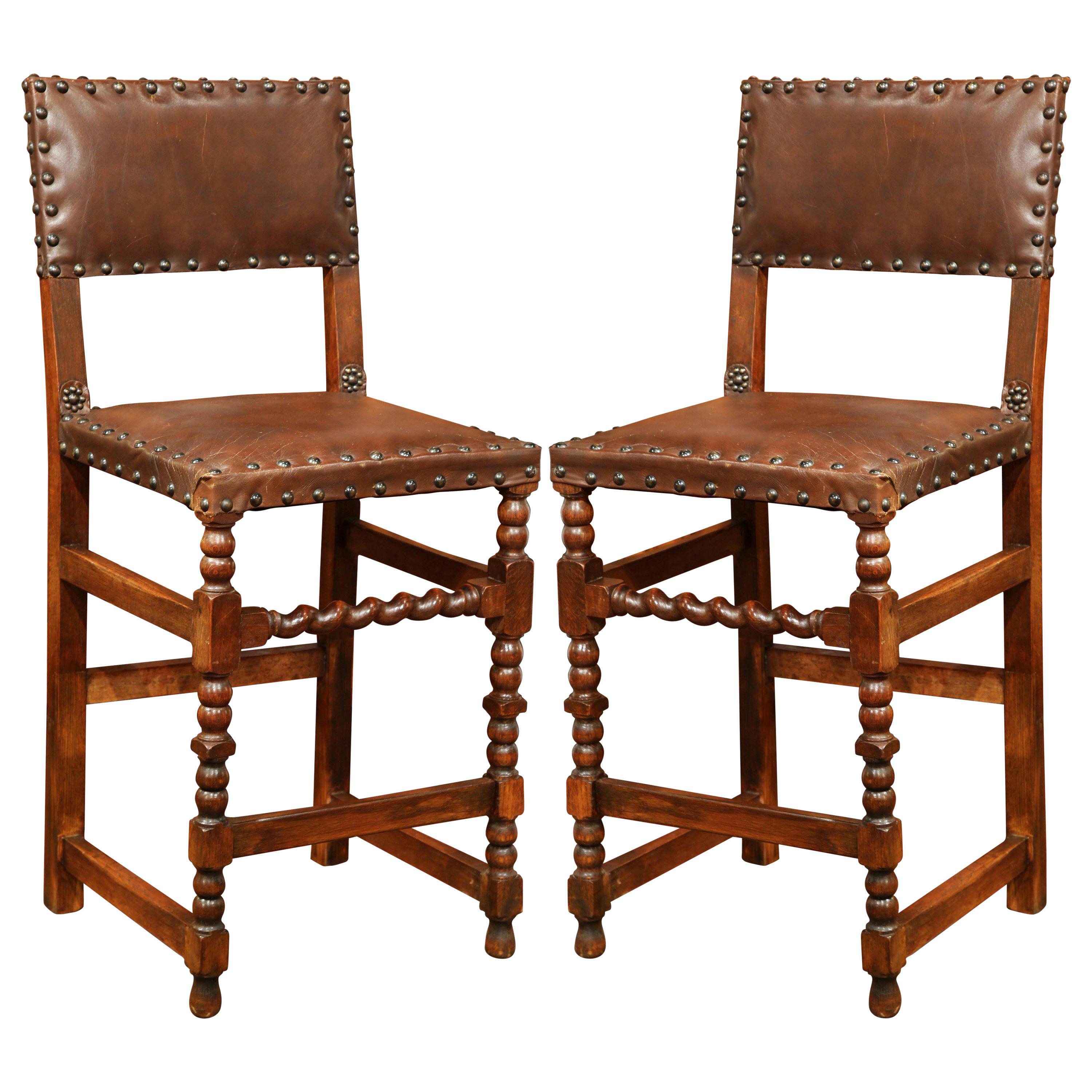 Pair of 19th Century French Carved Walnut Bar Stools with Original Brown Leather