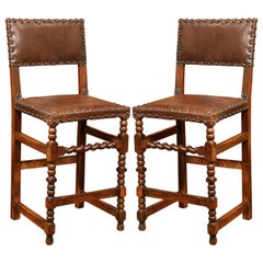 Antique Pair of 19th Century French Carved Walnut Bar Stools with Original Brown Leather