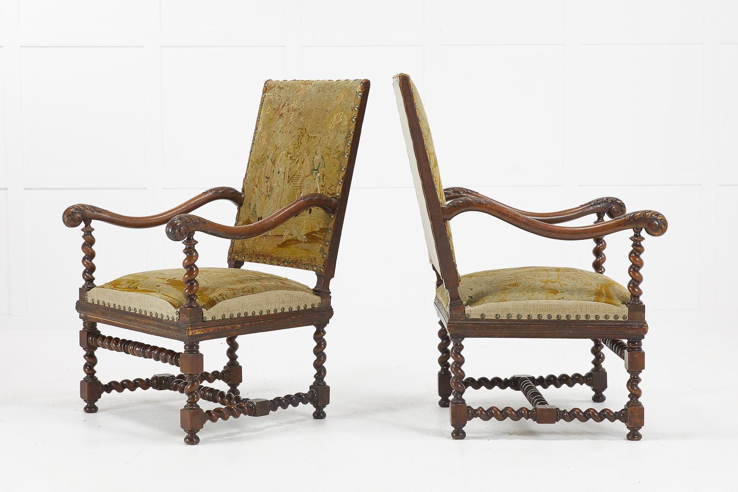 Pair of 19th century French walnut chairs with beautiful faded tapestry and carved barley twist arm supports, legs and stretchers.

Measures: Seat height 42.5cm
Seat depth 53cm.