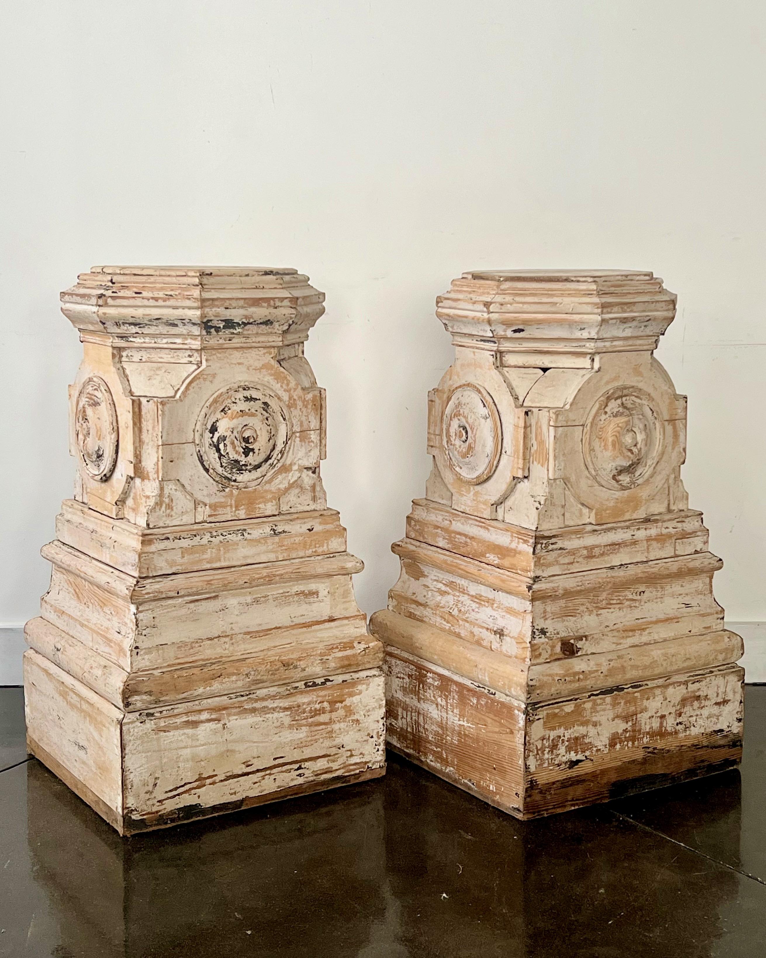 Pair of 19th centuryFrench carved wood pedestals/stands with
the four-sided column design and tops in octagon shape are handcrafted in symmetry and refined elegance with multiple tiered molded base.
Construction of the pedestals reflect a skillful
