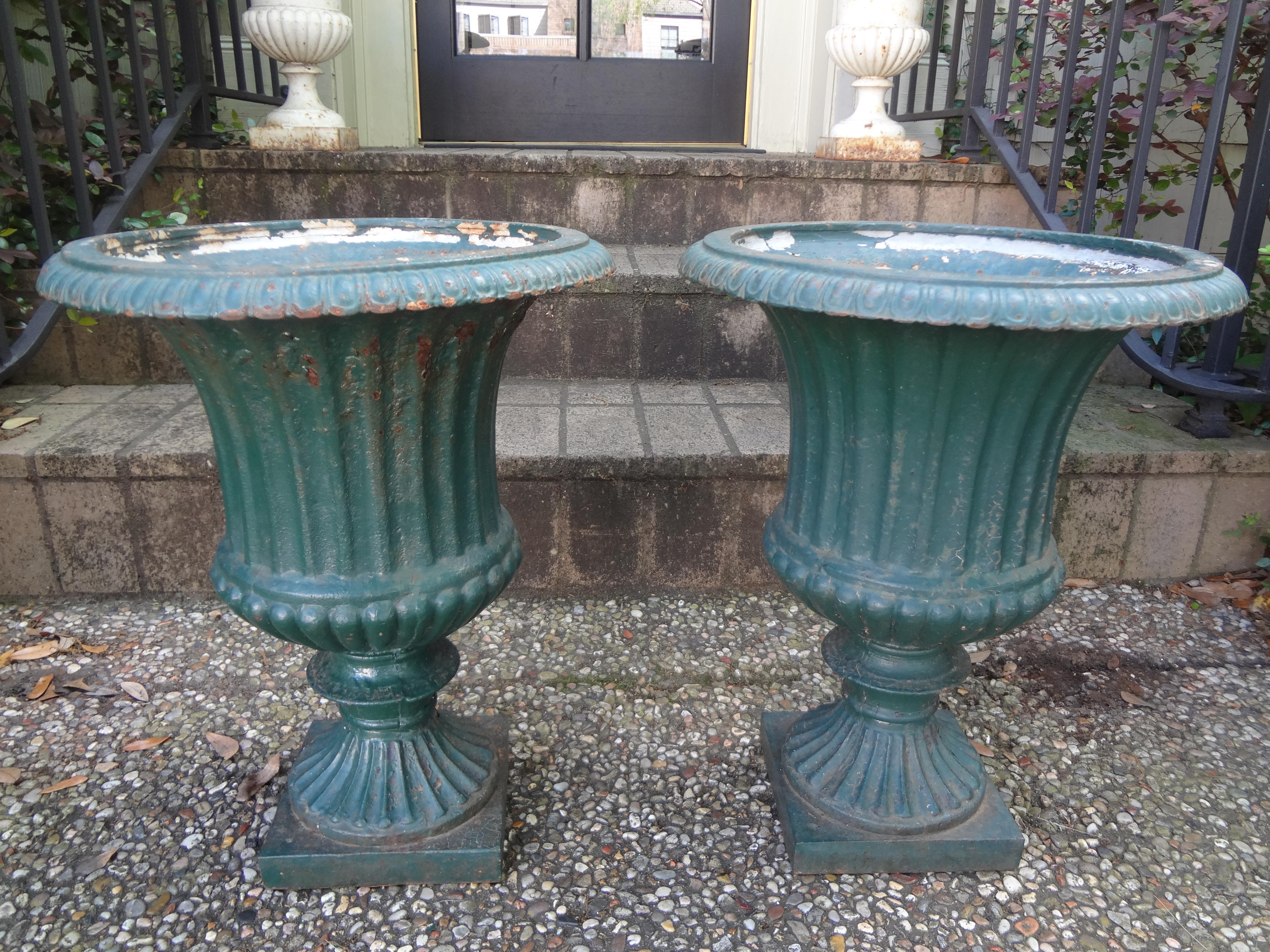 Lovely pair of antique French cast iron Campana garden urns, planters or jardinières. These beautiful Classic form French garden urns would make a lovely addition to your garden or can be used indoors. Deep well for planting of annuals or a