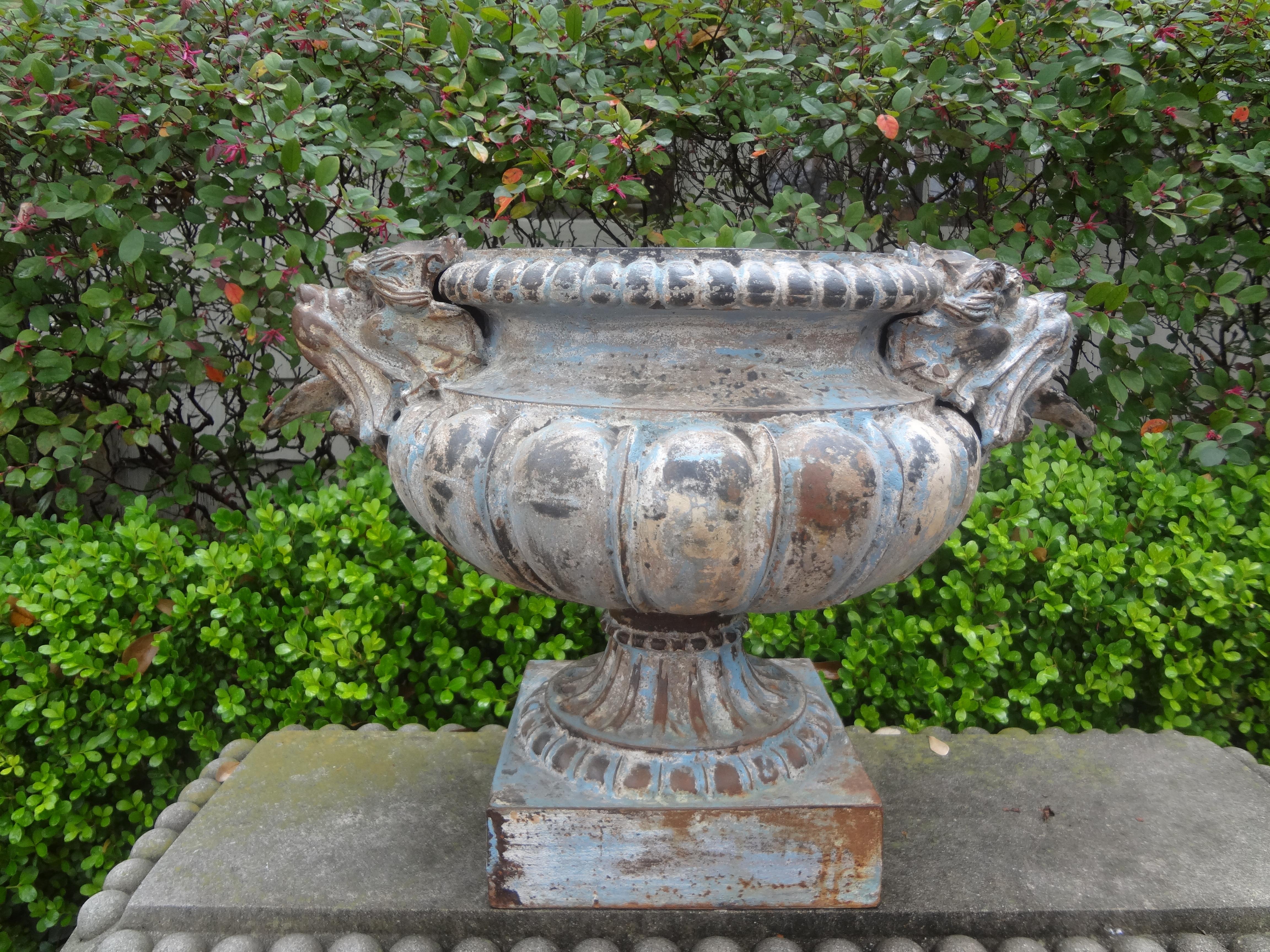 Pair of 19th century French cast iron Garden urns attributed to Alfred Corneau.
This rare pair of Mid-19th Century French cast iron garden urns are adorned with well detailed griffin handles are heavy weight and in very good condition.
Our