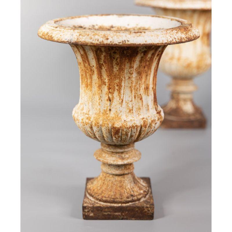 A superb large pair of antique 19th century French Neoclassical style white cast iron garden urns or planters. These beautiful jardinieres are a nice large size, solid and heavy, with the lovely original paint and patina. They would be fabulous