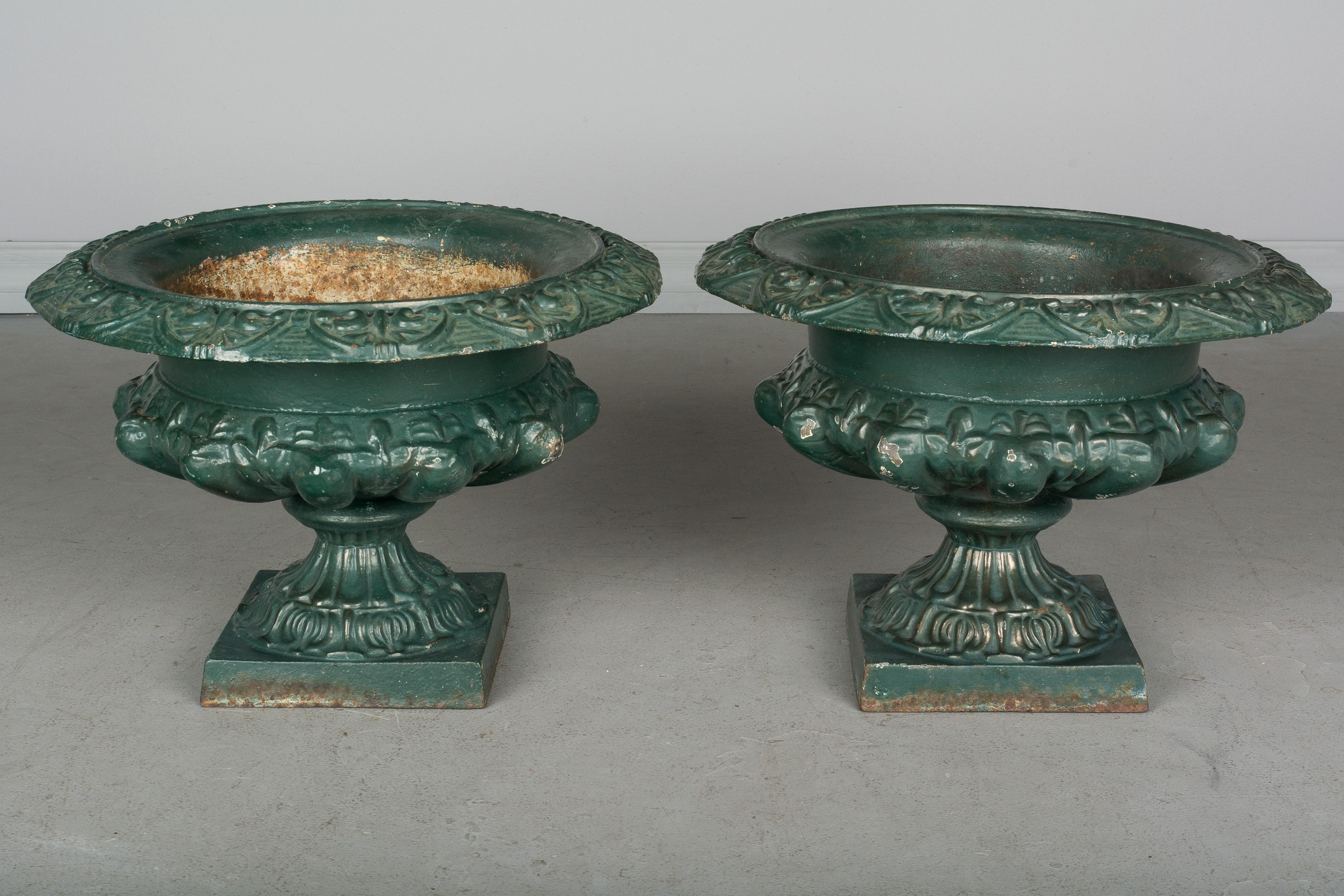 French Provincial Pair of 19th Century French Cast Iron Urns