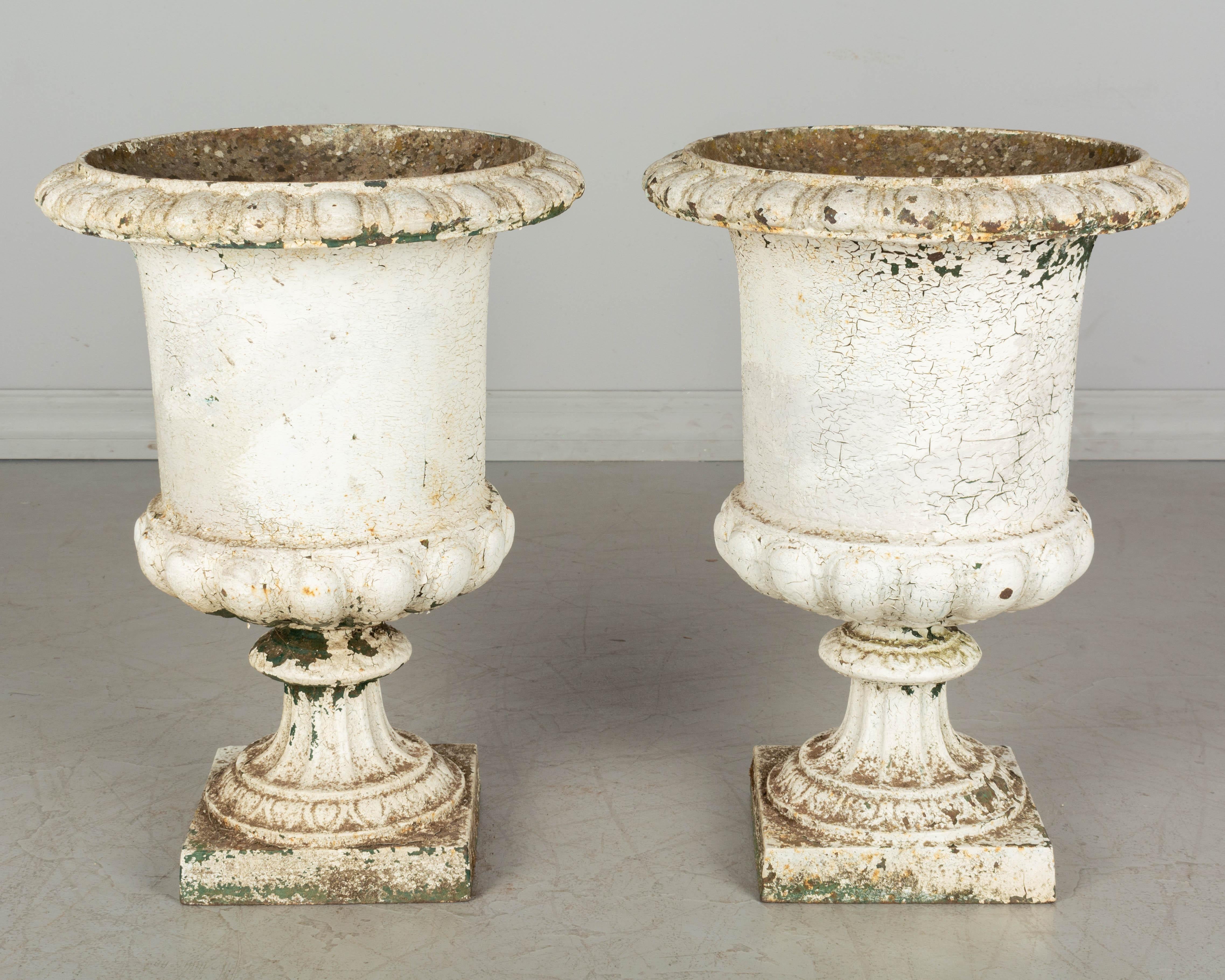 French Provincial Pair of 19th Century French Cast Iron Urns