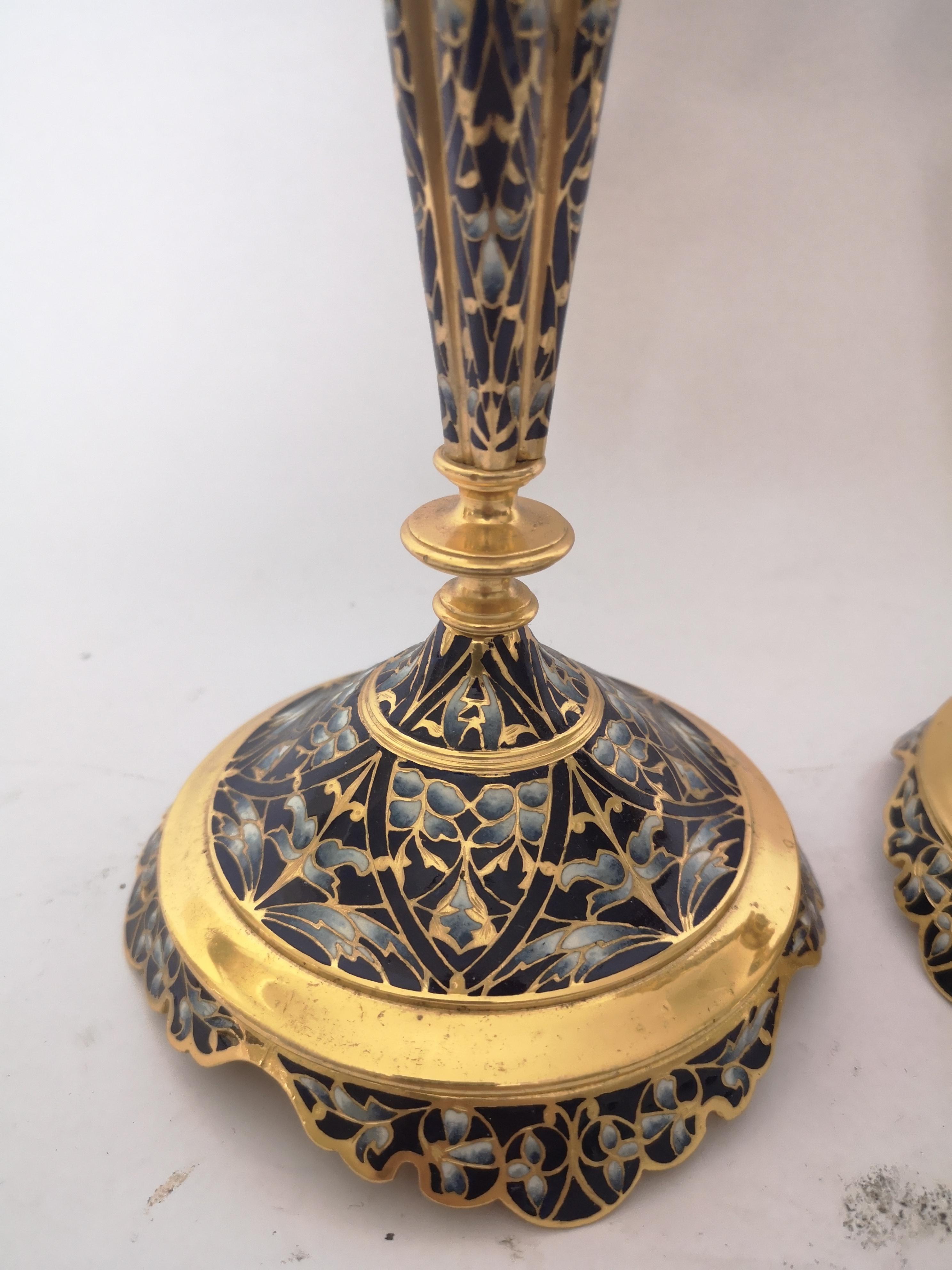 A pair of 19th century gilt bronze candlesticks with all-over blue champleve decoration.
French, circa 1900.