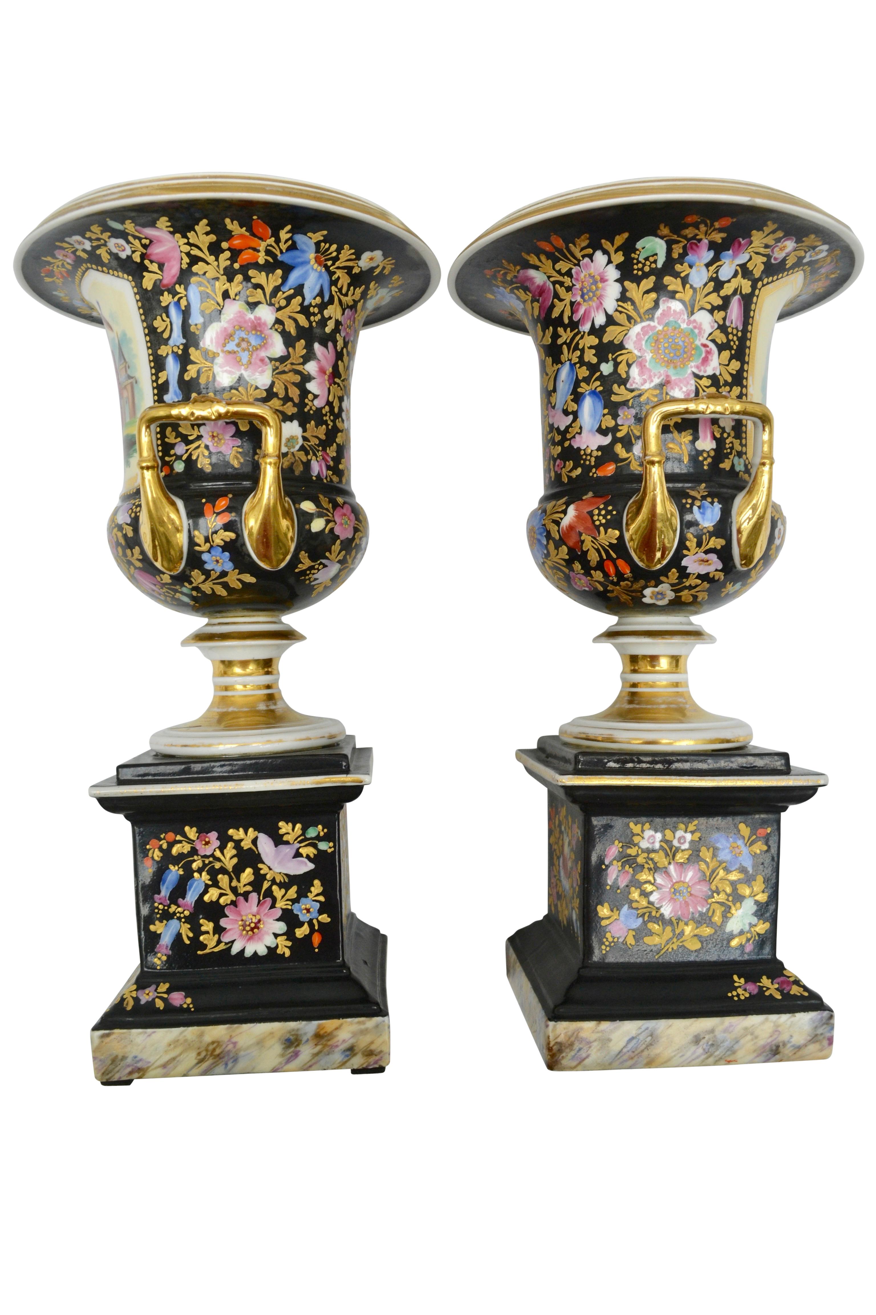 A pair of French campana shaped urns with chinoiserie painted and gilded figurative and floral decoration, that was very popular in the mid-19th century in Europe especially France and England. The vases are unsigned but in the style of Jacob Petite.