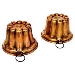 Par de moldes franceses de cobre para canelés del siglo XIX