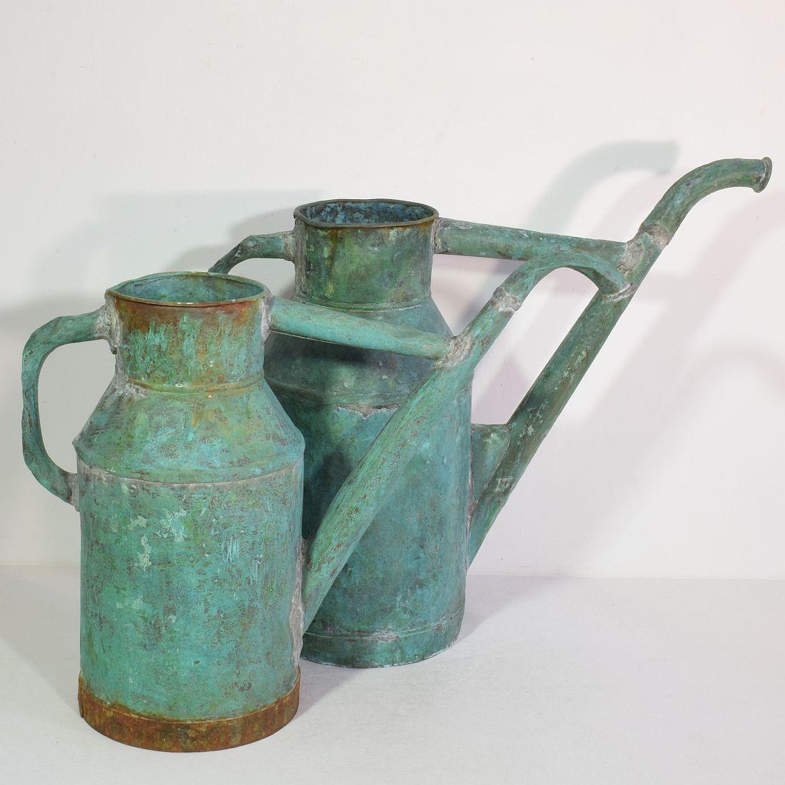 Stunning copper water cans with great patina. France, circa 1850-1900. Weathered, losses and old repairs.
Great to use as decorative objects in or outside. Might have leaks.