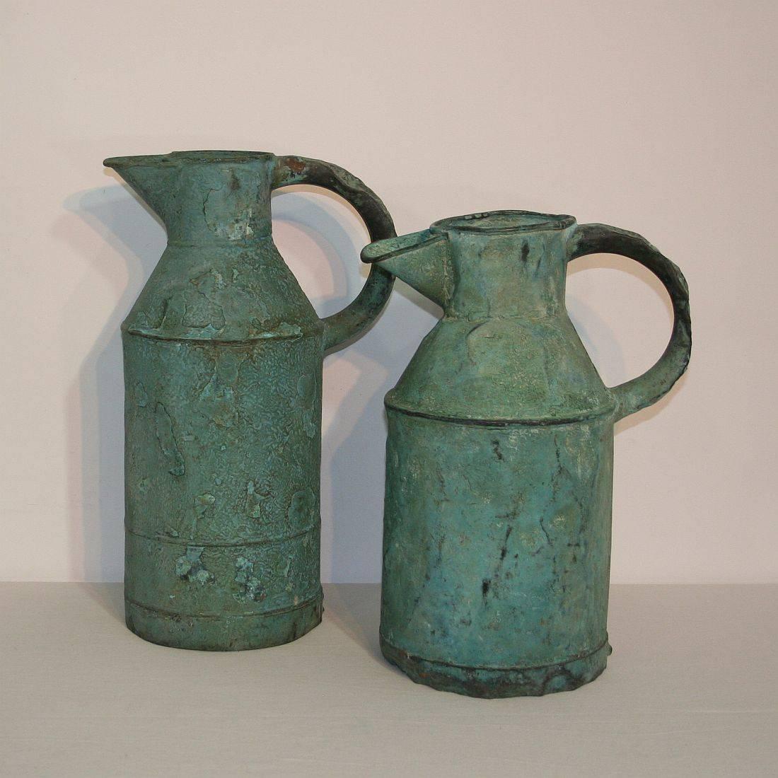 Stunning copper water jugs with great patina. France, circa 1850-1900. Weathered.