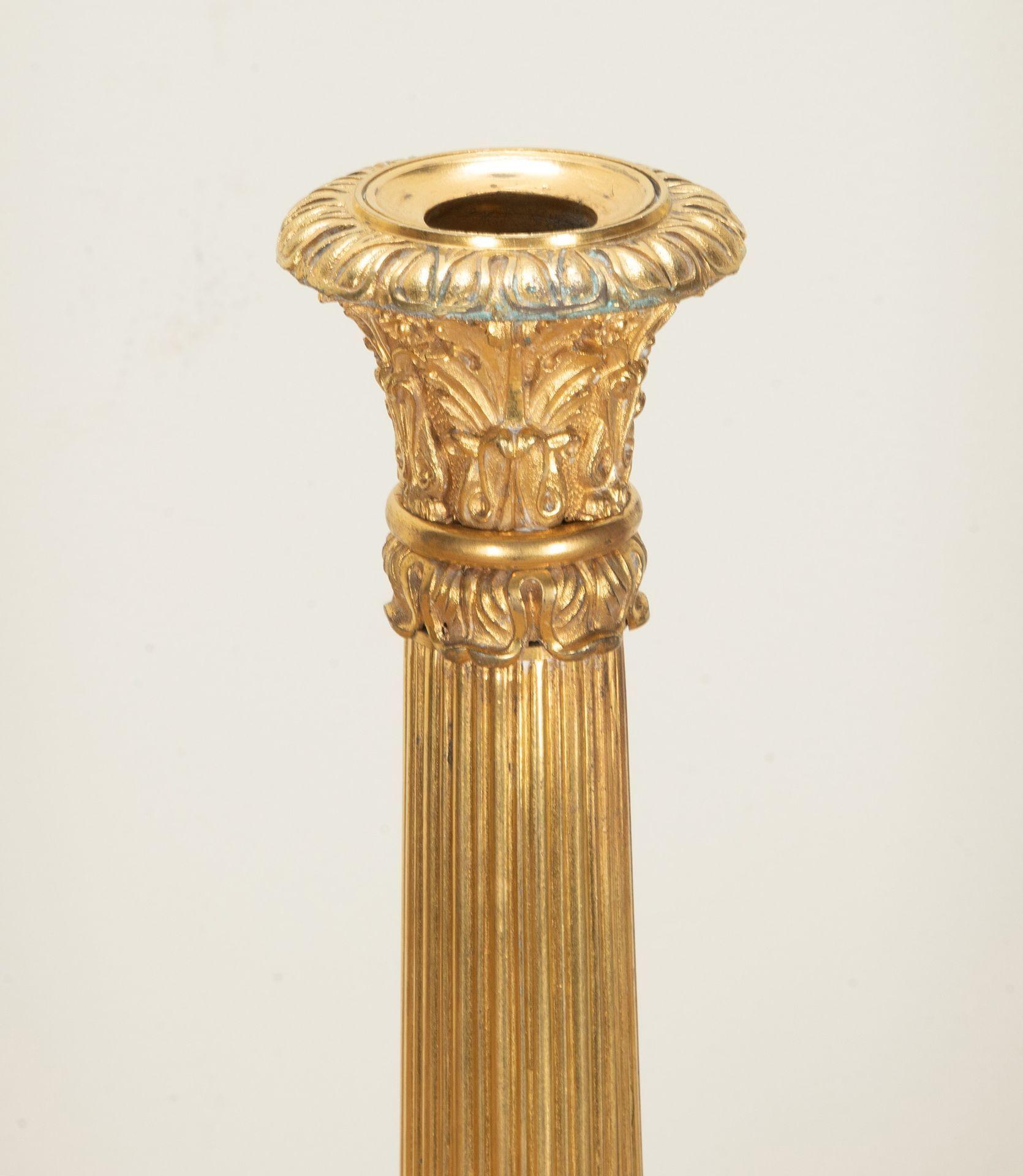 Directoire Pair of 19th Century French Corinthian Column Gilt Bronze Candlesticks For Sale