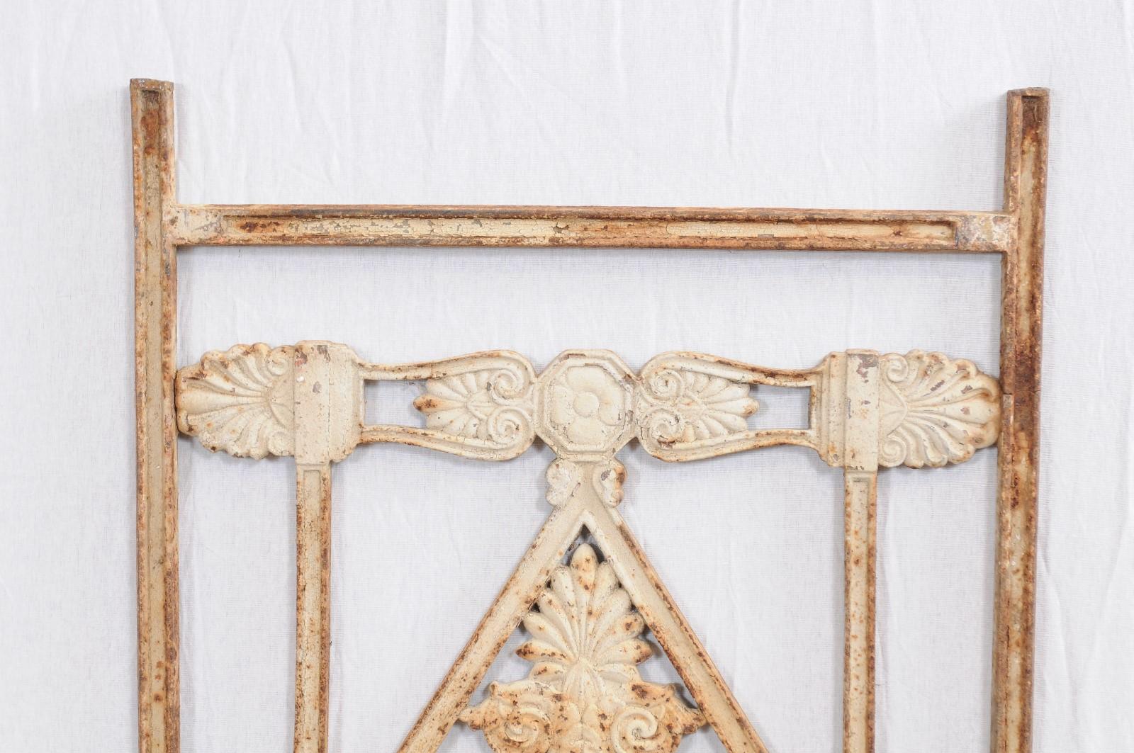 Directoire iron architectural elements in distressed white/cream painted finish, 19th century, France

Dimensions: A) 19
