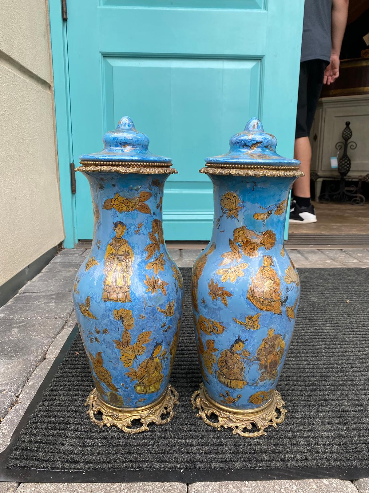 Pair of 19th century French églomisé chinoiserie covered vases with bronze mounts.