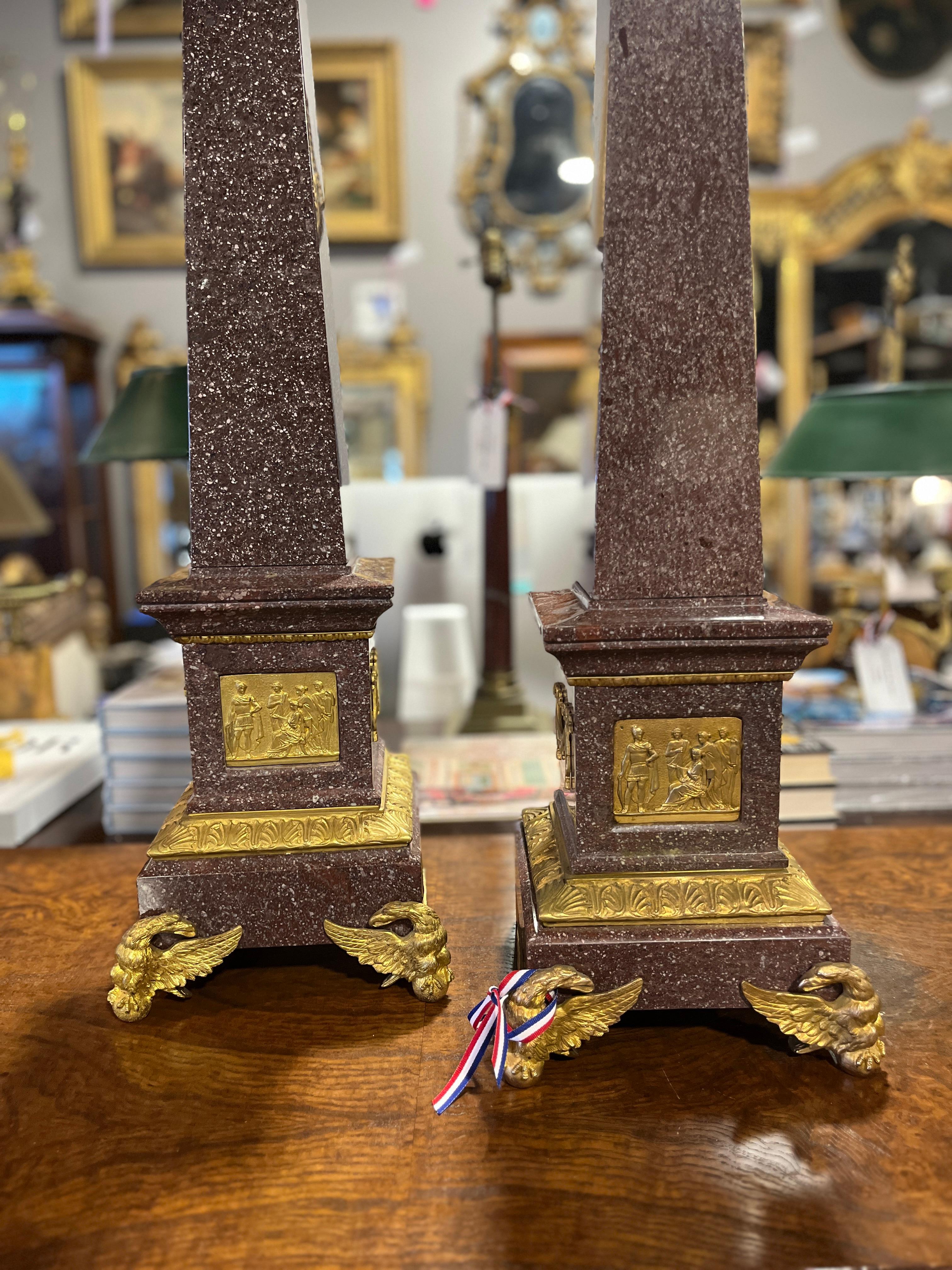 Pair of 19th Century French Egyptian Revival Porphyry Obelisks w Ormolu mounts.  Please note: Though a pair, one obelisk is 34 1/2