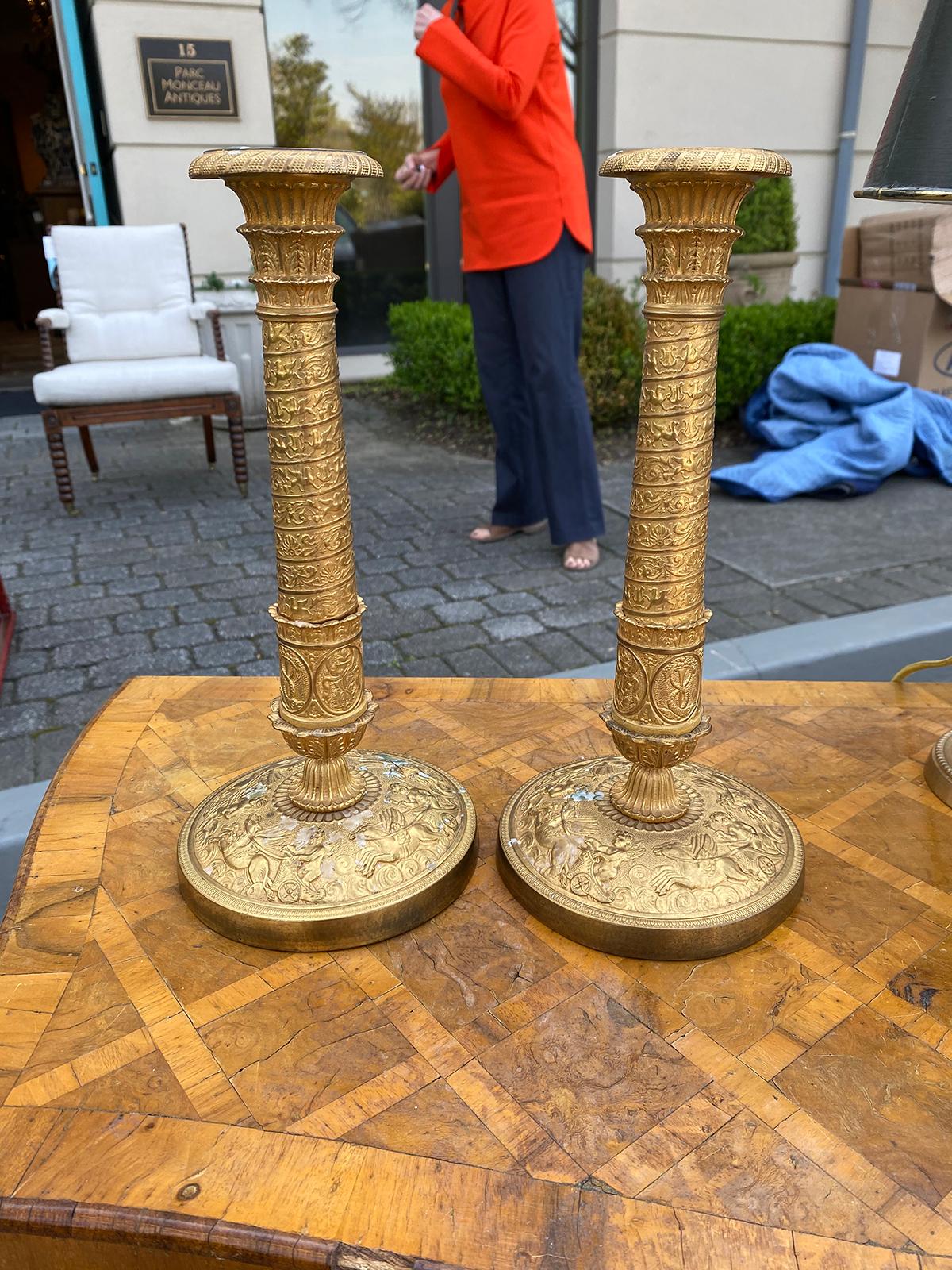 Pair of 19th century French Empire Charles X gilt candlesticks. Great detail.