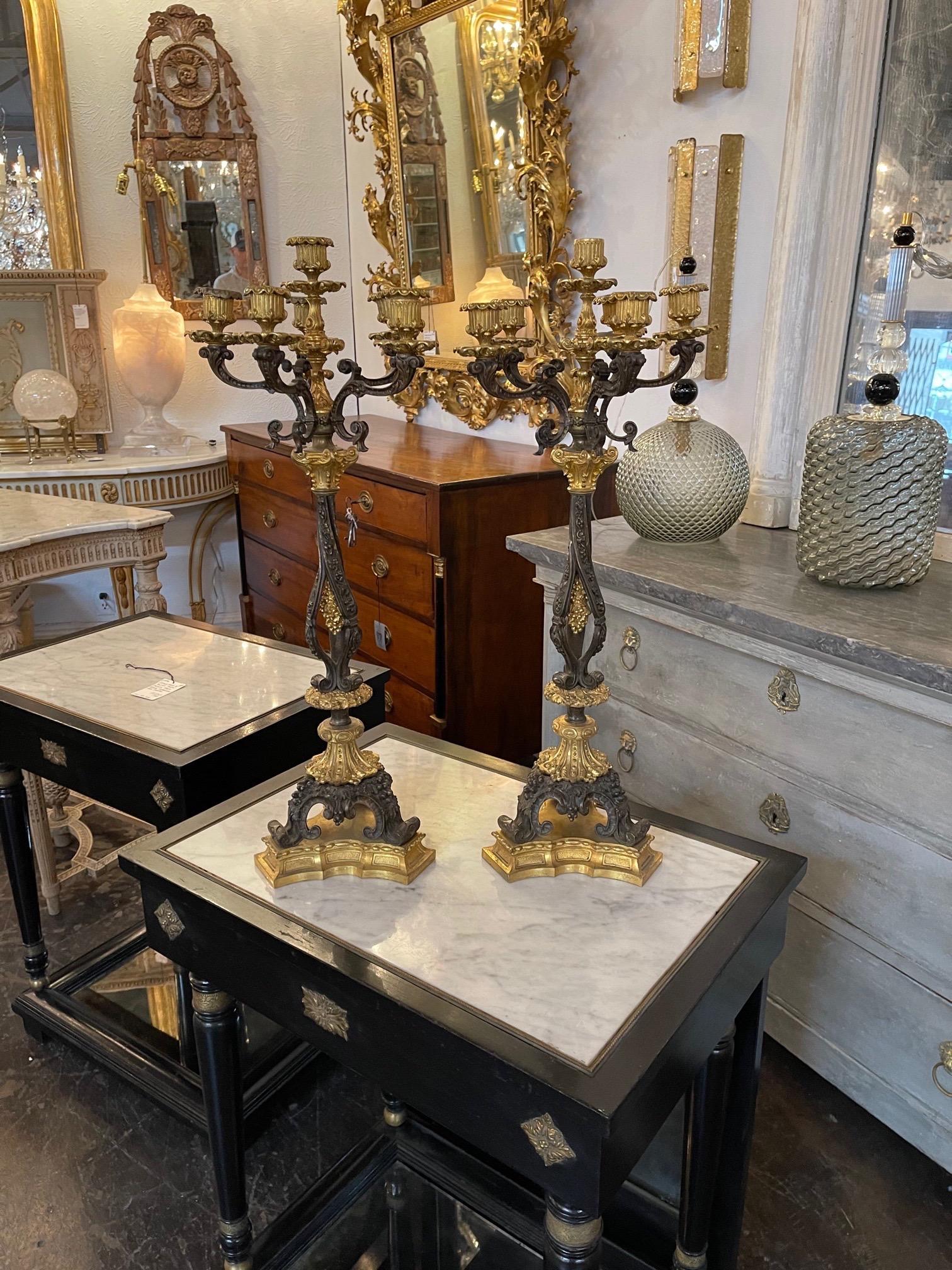 Exquisite pair of 19th century French Empire gilt bronze candelabras with 6-light. Very fine quality. Super impressive!