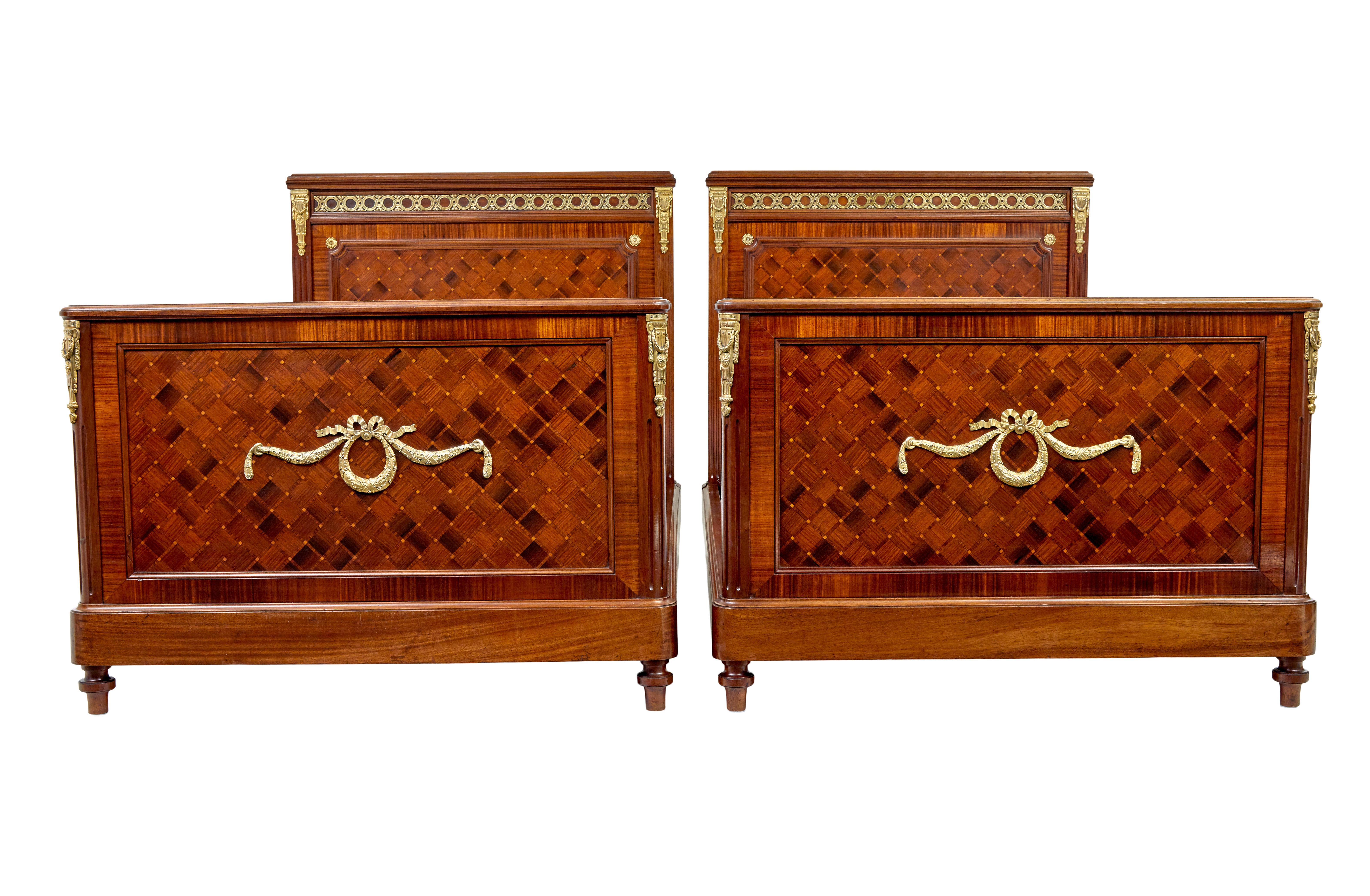 Pair of 19th century french empire mahogany and walnut beds circa 1890.

Fine quality pair of large single beds of the empire revival period.  Beautifully made from walnut and mahogany and further decorated with ormolu mounts.

Headboard and foot