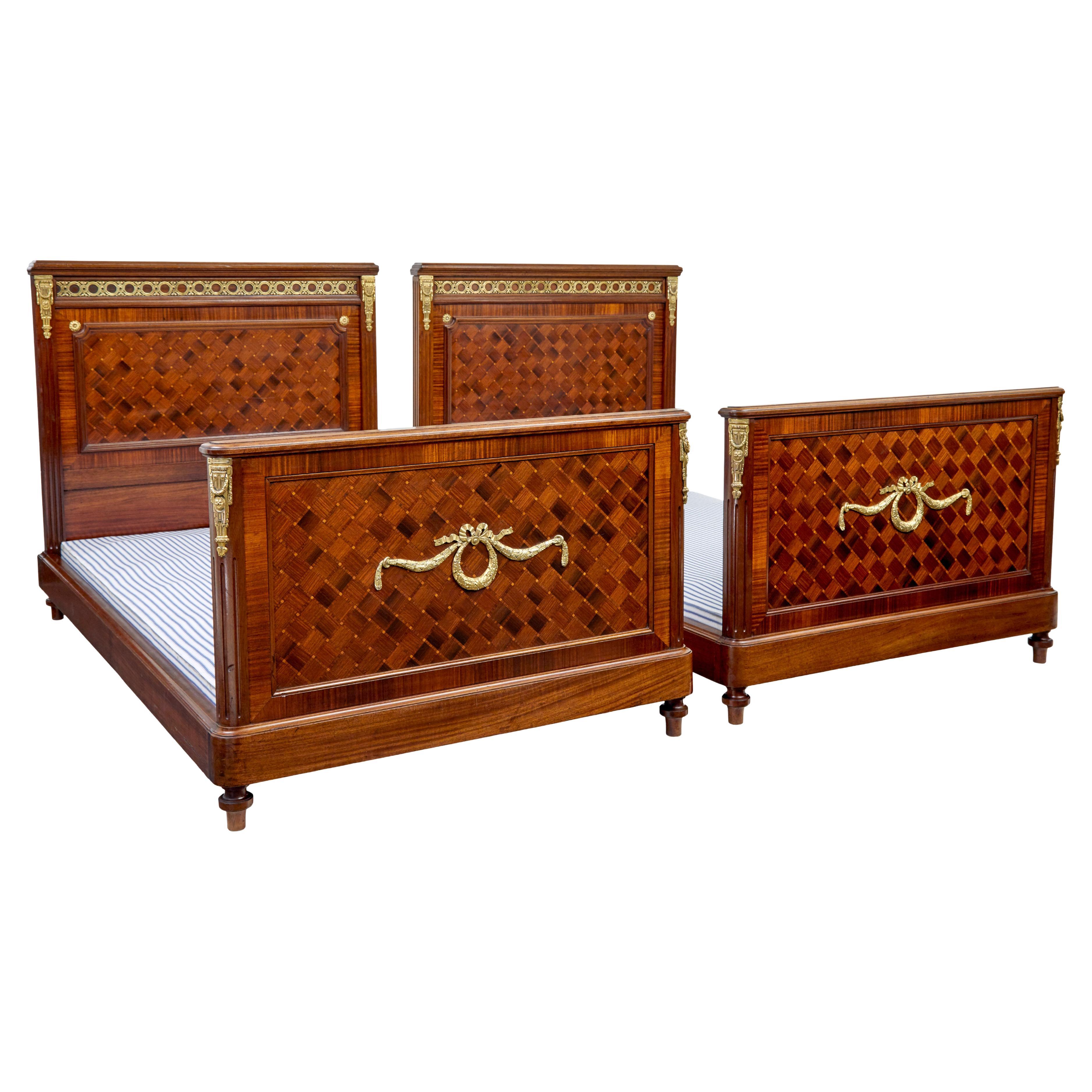 Pair of 19th century French empire mahogany and walnut beds For Sale