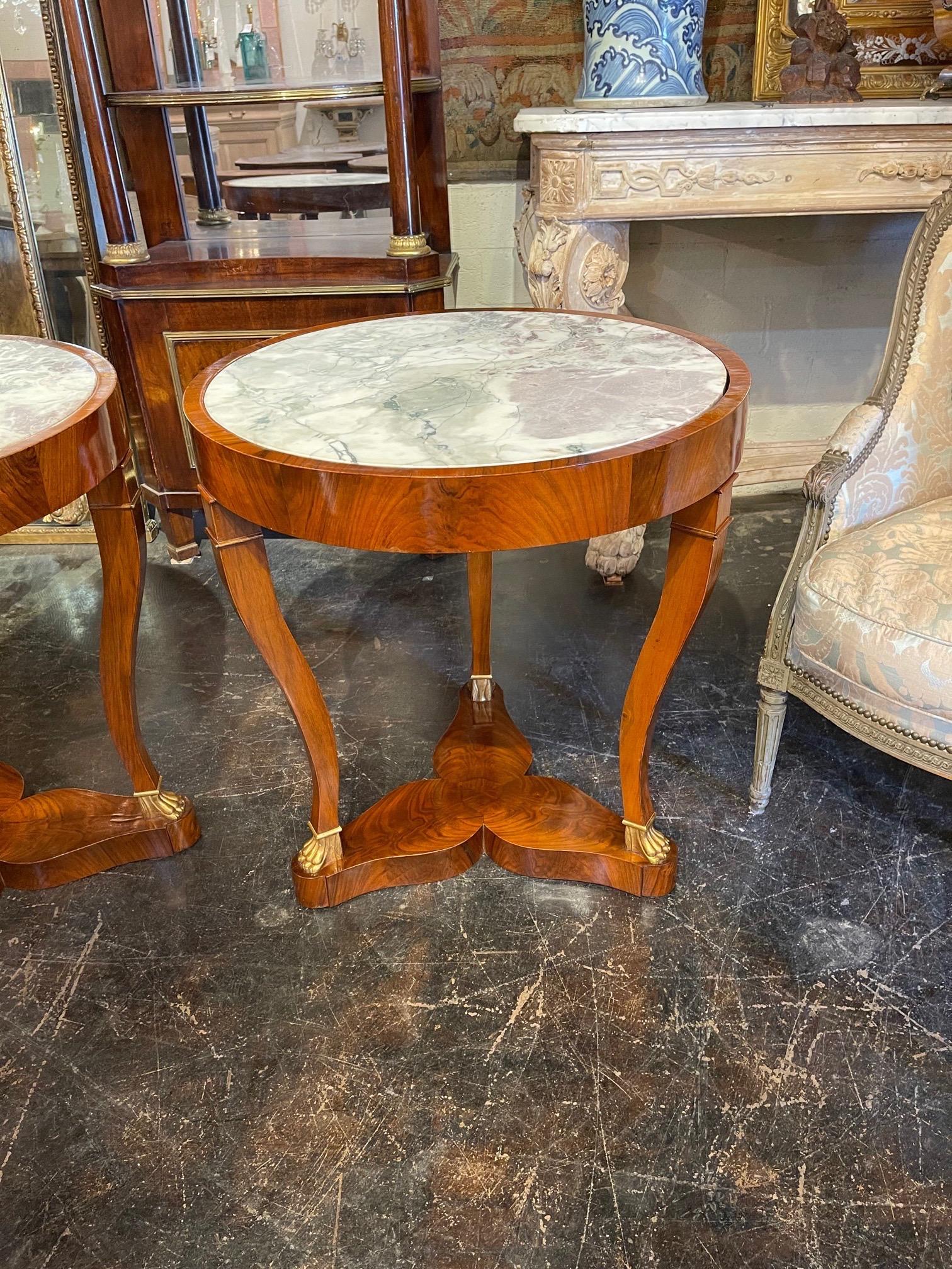 Exquisite pair of 19th century French empire mahogany tables with breccia inset marble. Very fine finish on these and the marble is gorgeous. Superb!