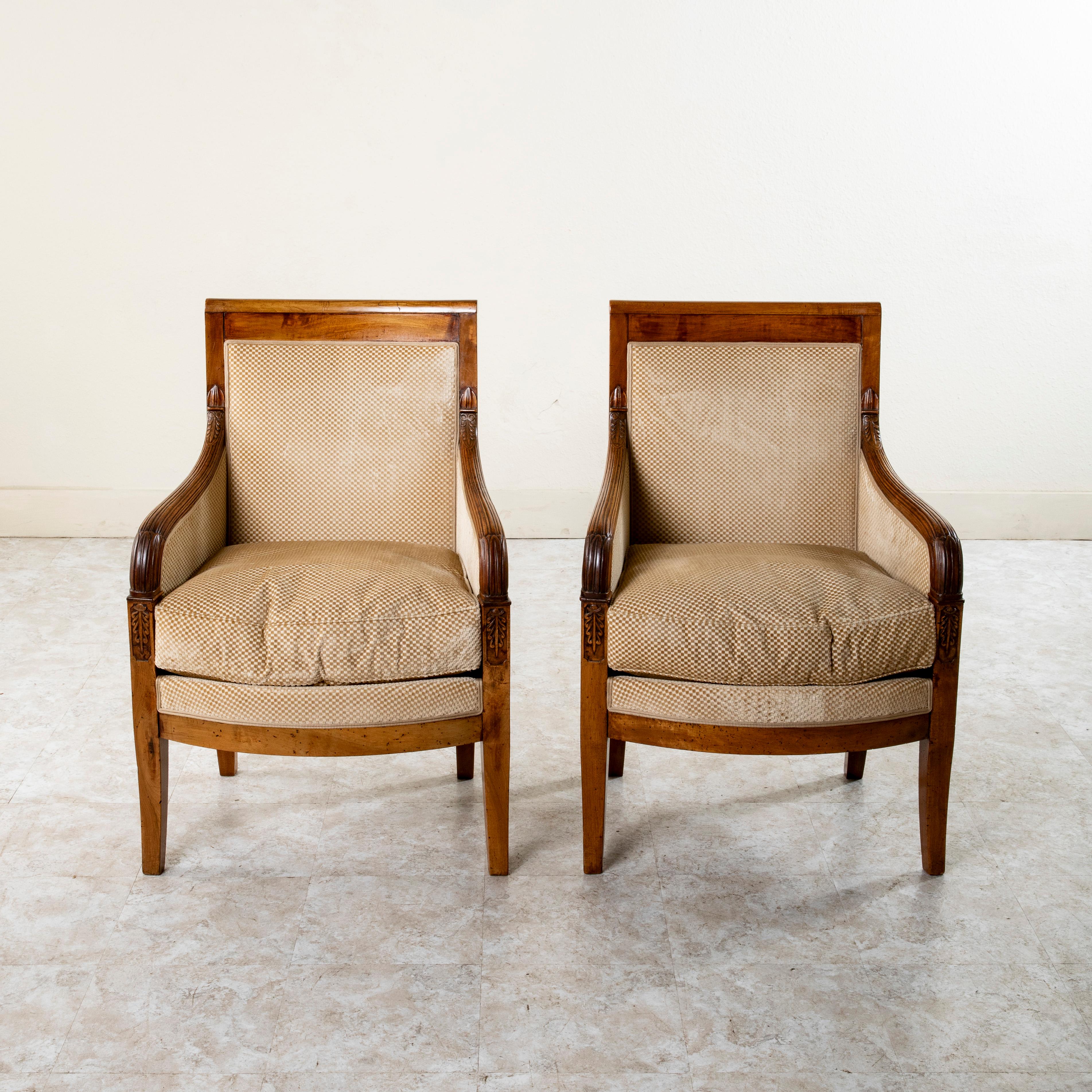 Hand-Carved Pair of 19th Century French Empire Period Hand Carved Walnut Bergeres, Armchairs For Sale