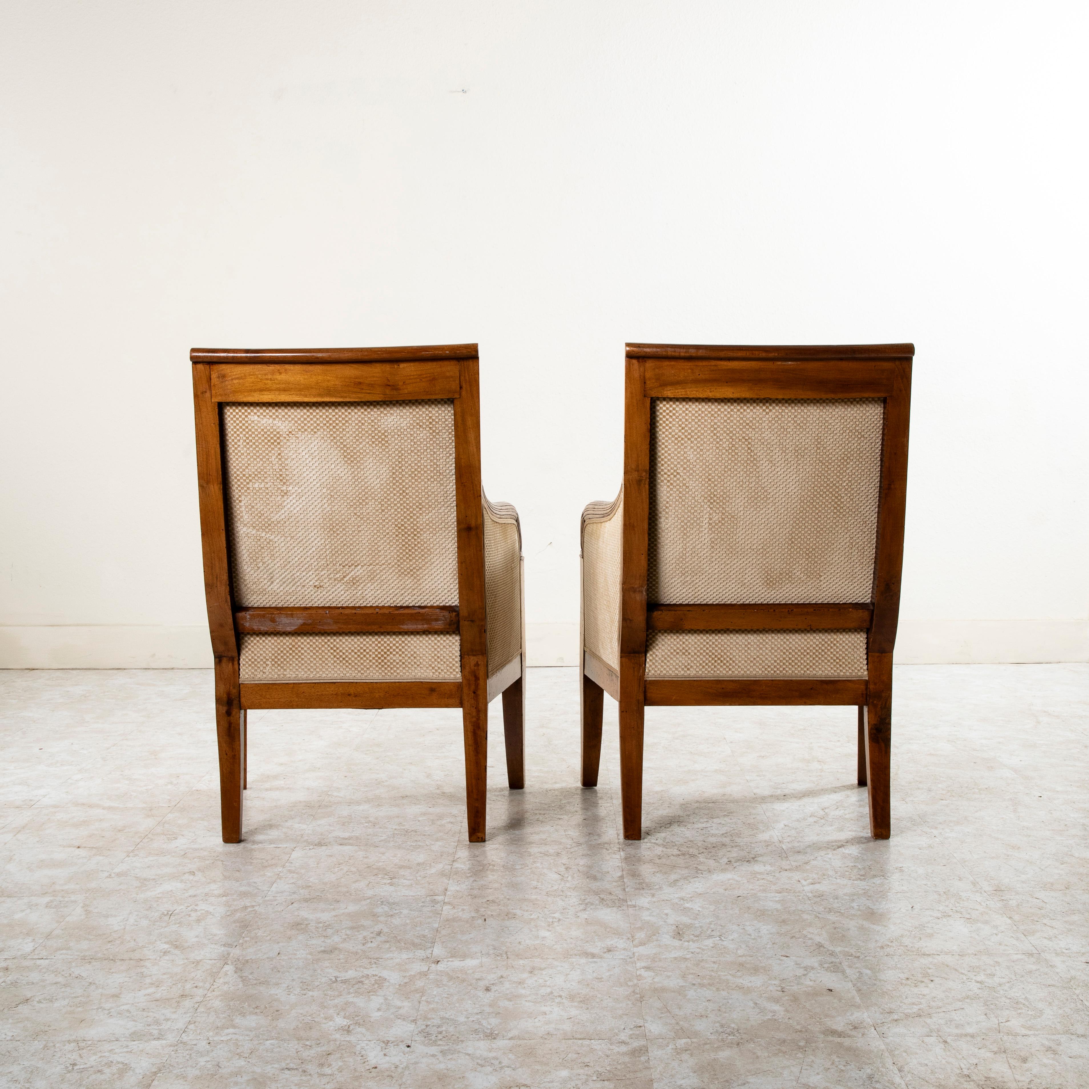 Pair of 19th Century French Empire Period Hand Carved Walnut Bergeres, Armchairs For Sale 1