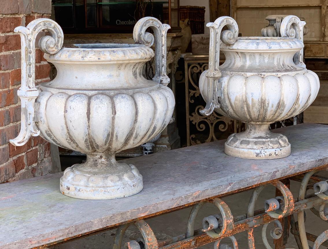 A beautiful pair of French enamelled iron urns by Alfred Corneau. These will look beautiful indoors or the garden.


