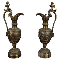 Pair of 19th Century French Gilt Bronze Bacchanalian Ewers with Cherubs